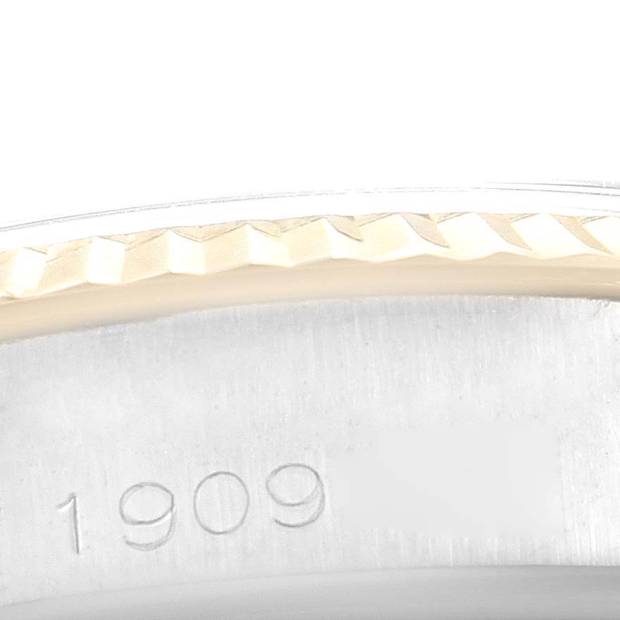The image shows a close-up of the bezel and part of the case back of the Rolex Vintage Collection 5500 Men's Steel and Gold (two tone) Champagne Dial 5500 Men's Steel and Gold (two tone) Champagne Dial watch, with the number "1909" visible.