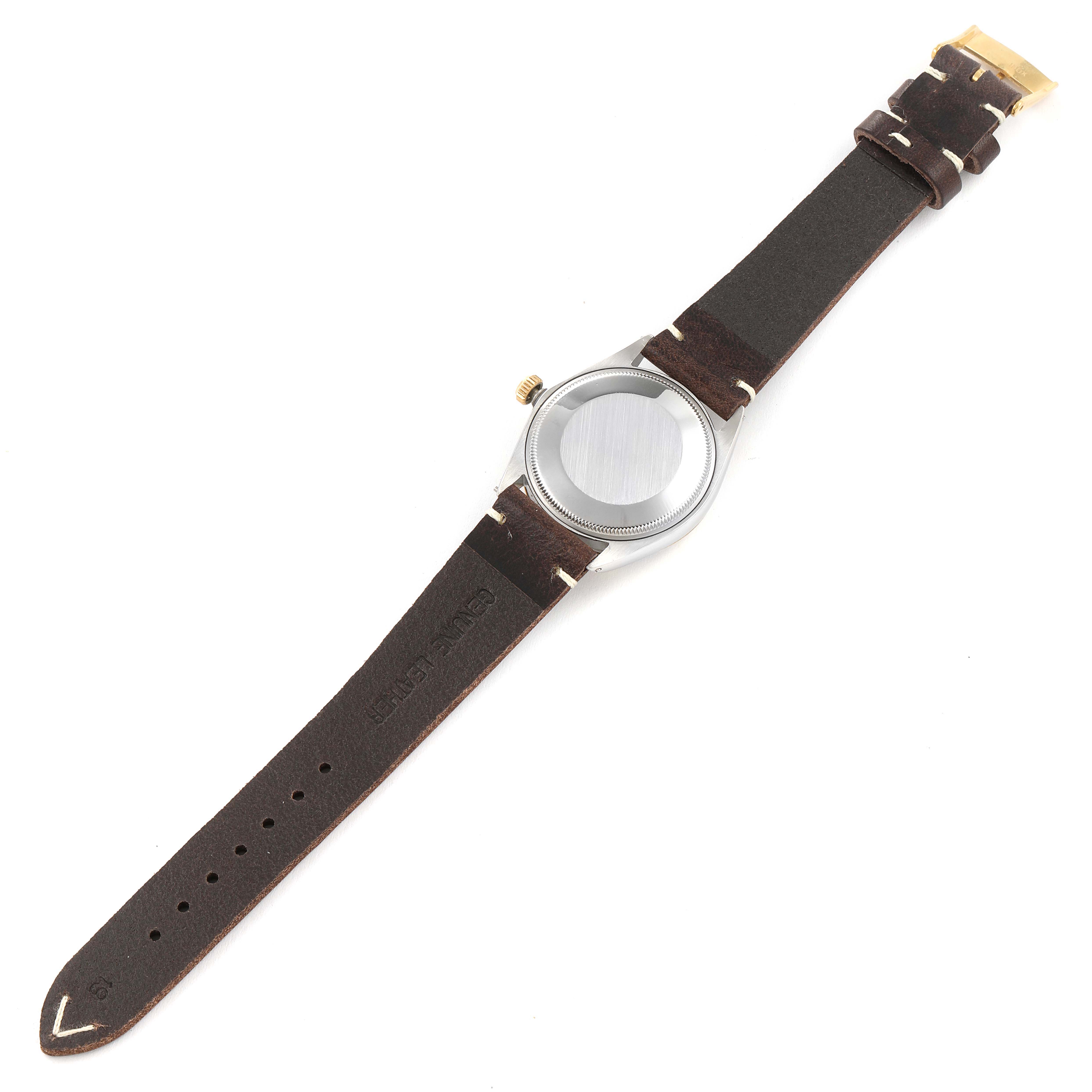 This image shows the back view of a Vintage Collection Rolex watch with a brown leather strap.