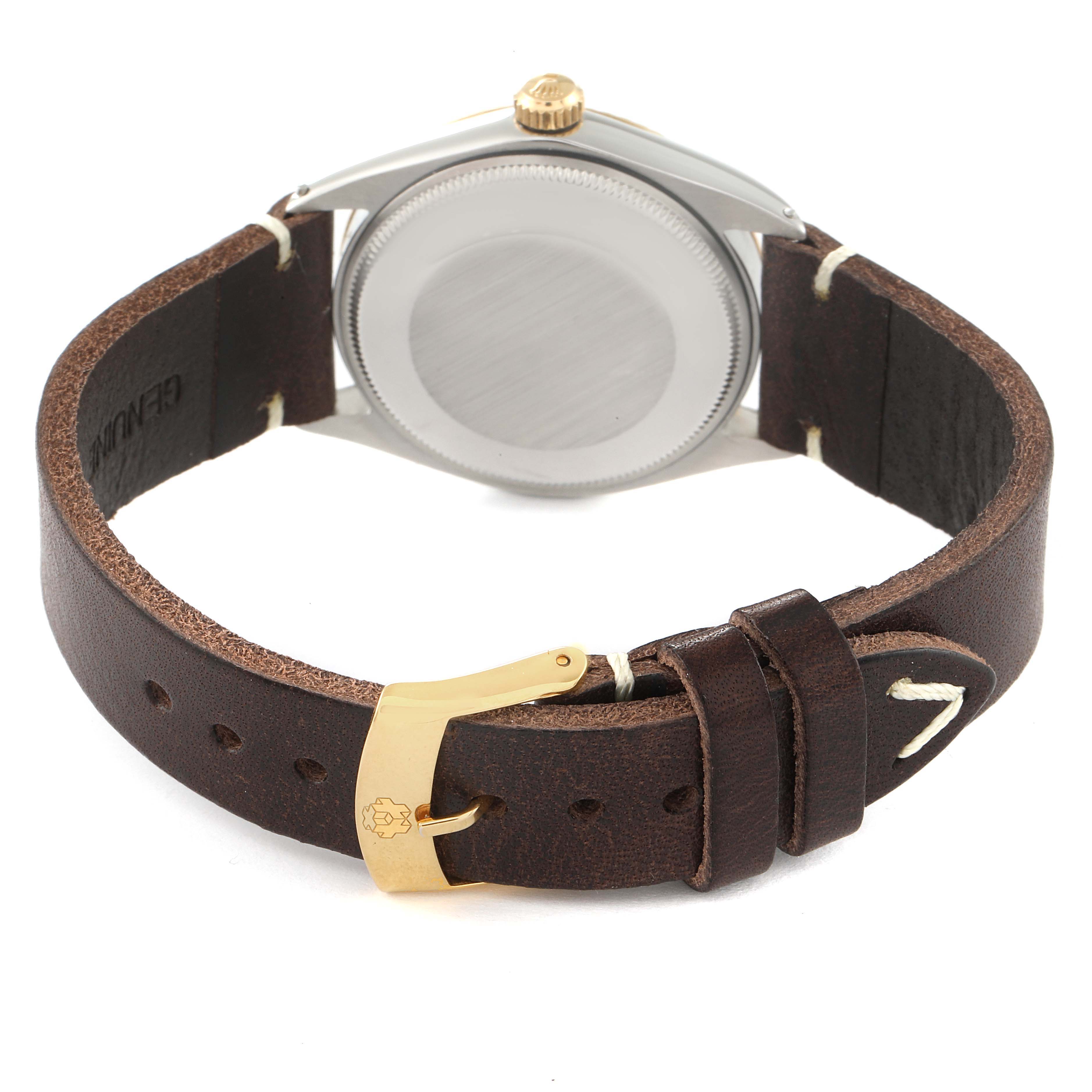 The image shows the back view of a Rolex Vintage Collection 5500 Men's Steel and Gold (two tone) Champagne Dial 5500 Men's Steel and Gold (two tone) Champagne Dial watch, highlighting the caseback and leather strap with a gold buckle.