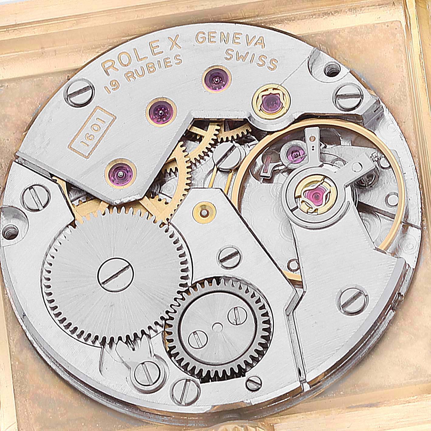 This image shows the intricate inner mechanics of the Rolex Cellini 4016 Men's Yellow Gold White Dial 4016 Men's Yellow Gold White Dial watch movement from a top-down angle.