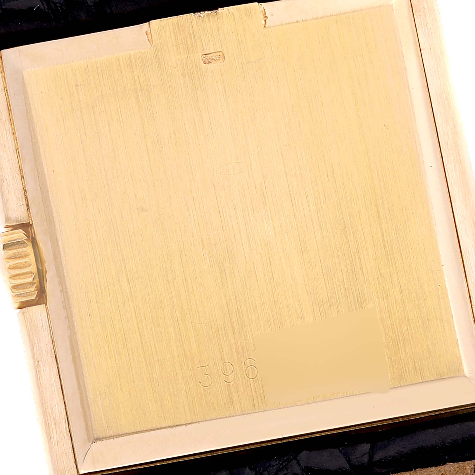 The image shows the case back of the Rolex Cellini 4016 Men's Yellow Gold White Dial 4016 Men's Yellow Gold White Dial watch, displaying the serial and model number, viewing the gold surface head-on.