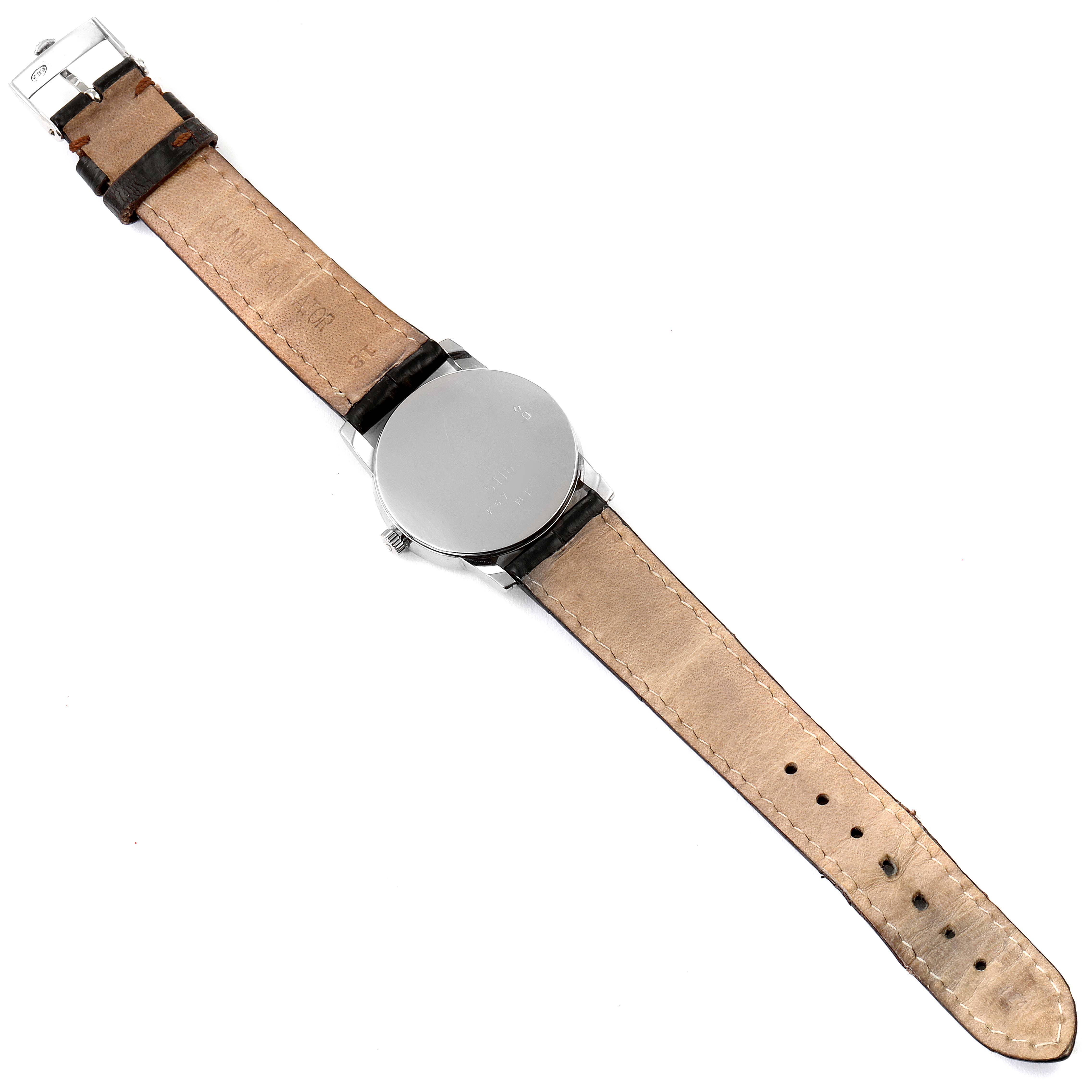 The image shows the back of a Rolex Cellini 5116 Men's White Gold Brown Dial 5116 Men's White Gold Brown Dial watch fully extended, highlighting its case back and leather strap.