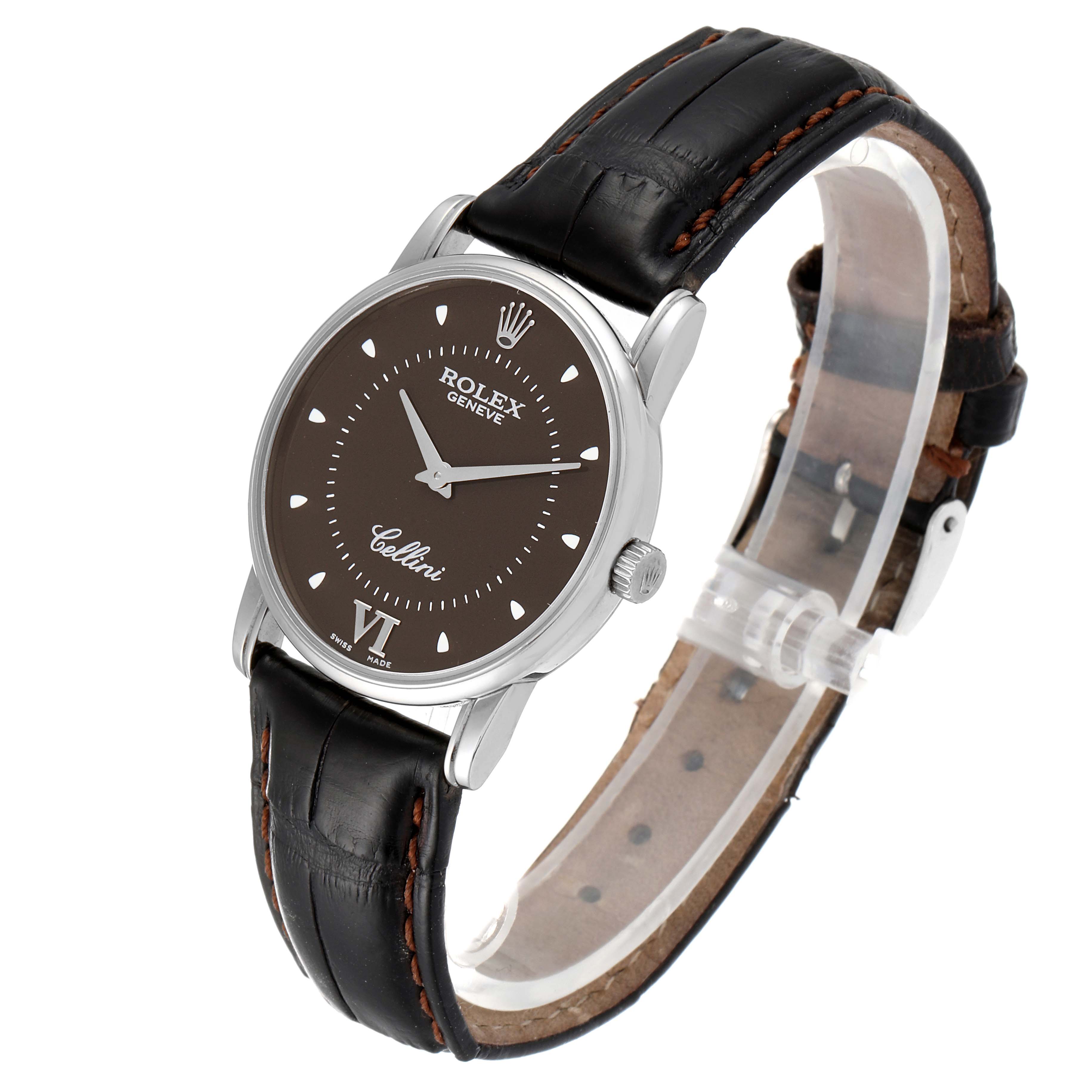 The Rolex Cellini 5116 Men's White Gold Brown Dial 5116 Men's White Gold Brown Dial watch is shown at a slight side angle, revealing its face, case, and black leather strap.