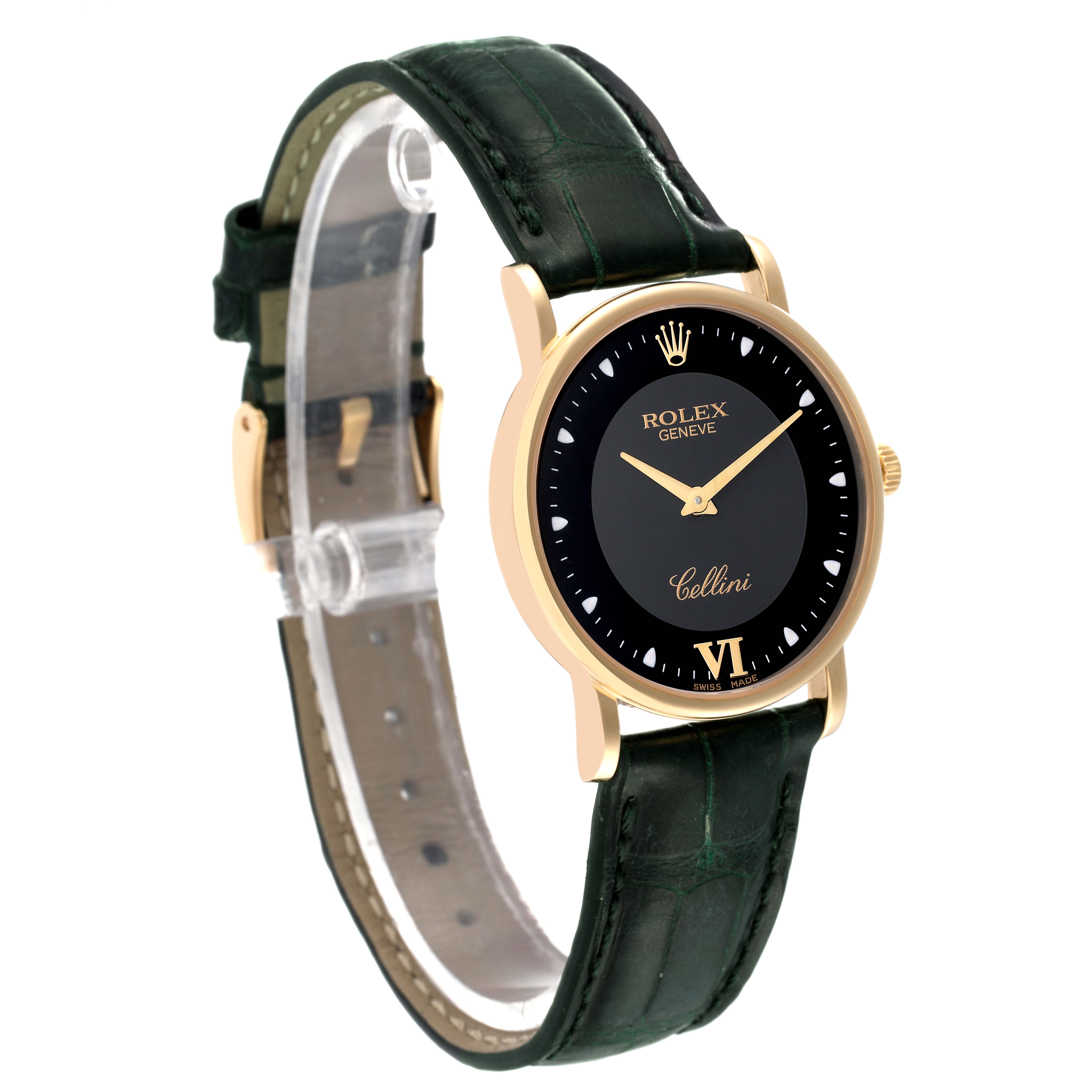 The Rolex Cellini 5115 Men's Yellow Gold Black Dial 5115 Men's Yellow Gold Black Dial watch is shown at a 3/4 angle displaying the black dial, gold case, and dark green leather strap.