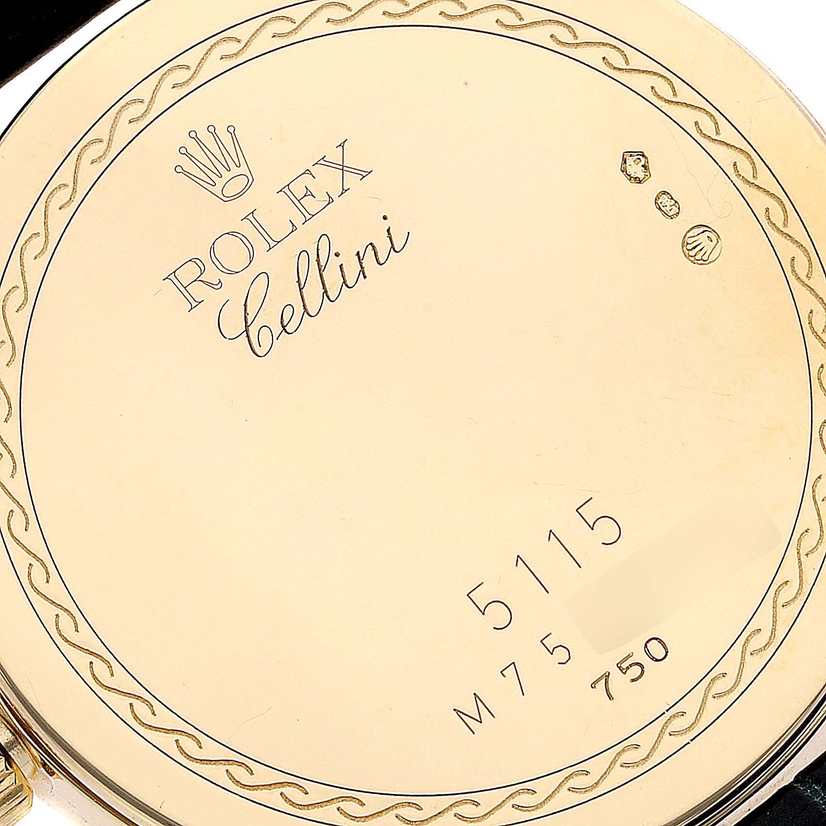 The image shows the back case of a Rolex Cellini 5115 Men's Yellow Gold Black Dial 5115 Men's Yellow Gold Black Dial watch, displaying its model number and hallmark stamps.