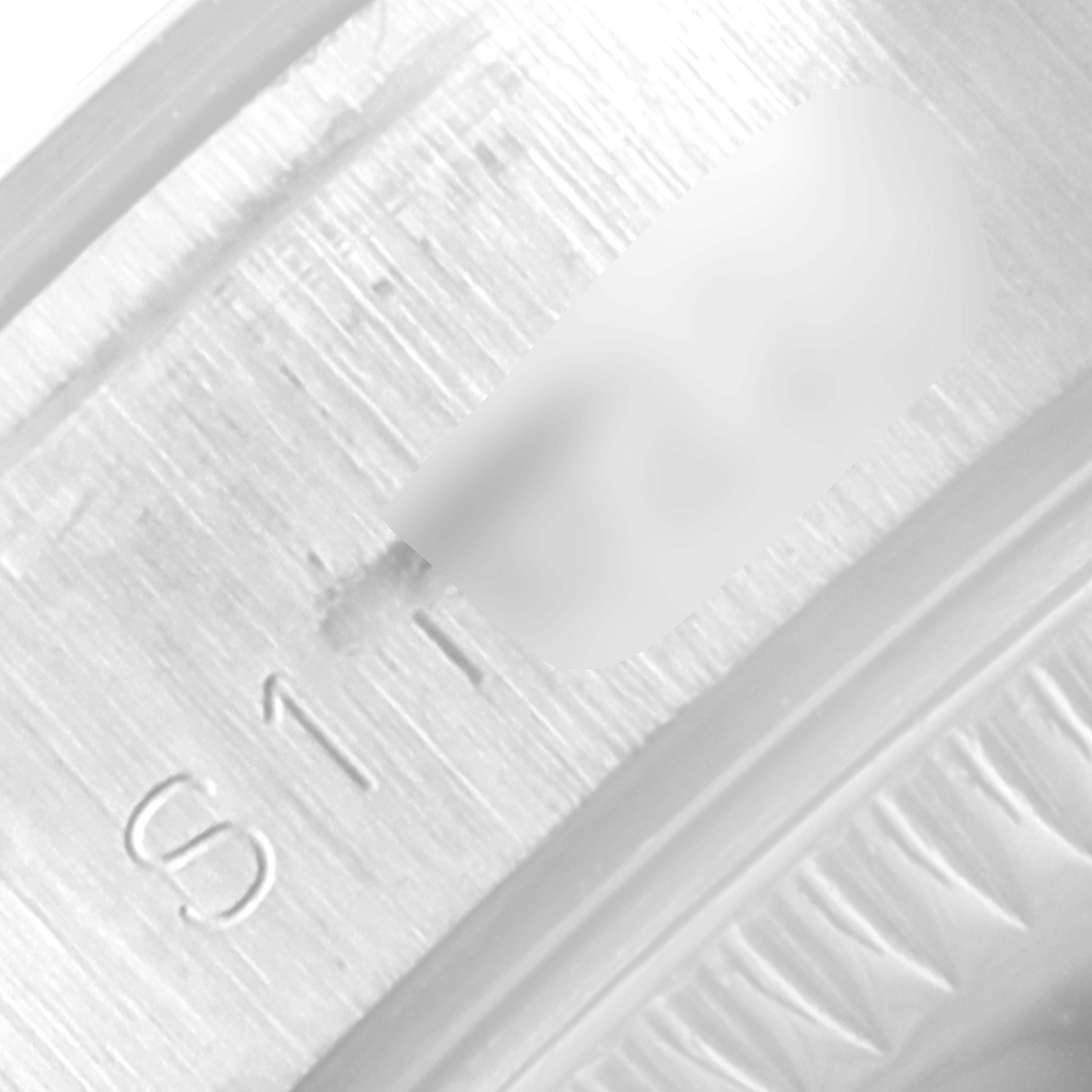 This close-up image shows the engraved serial number on the inner rim of a Rolex Date 69160 Women's Stainless Steel Blue Dial 69160 Women's Stainless Steel Blue Dial model watch.