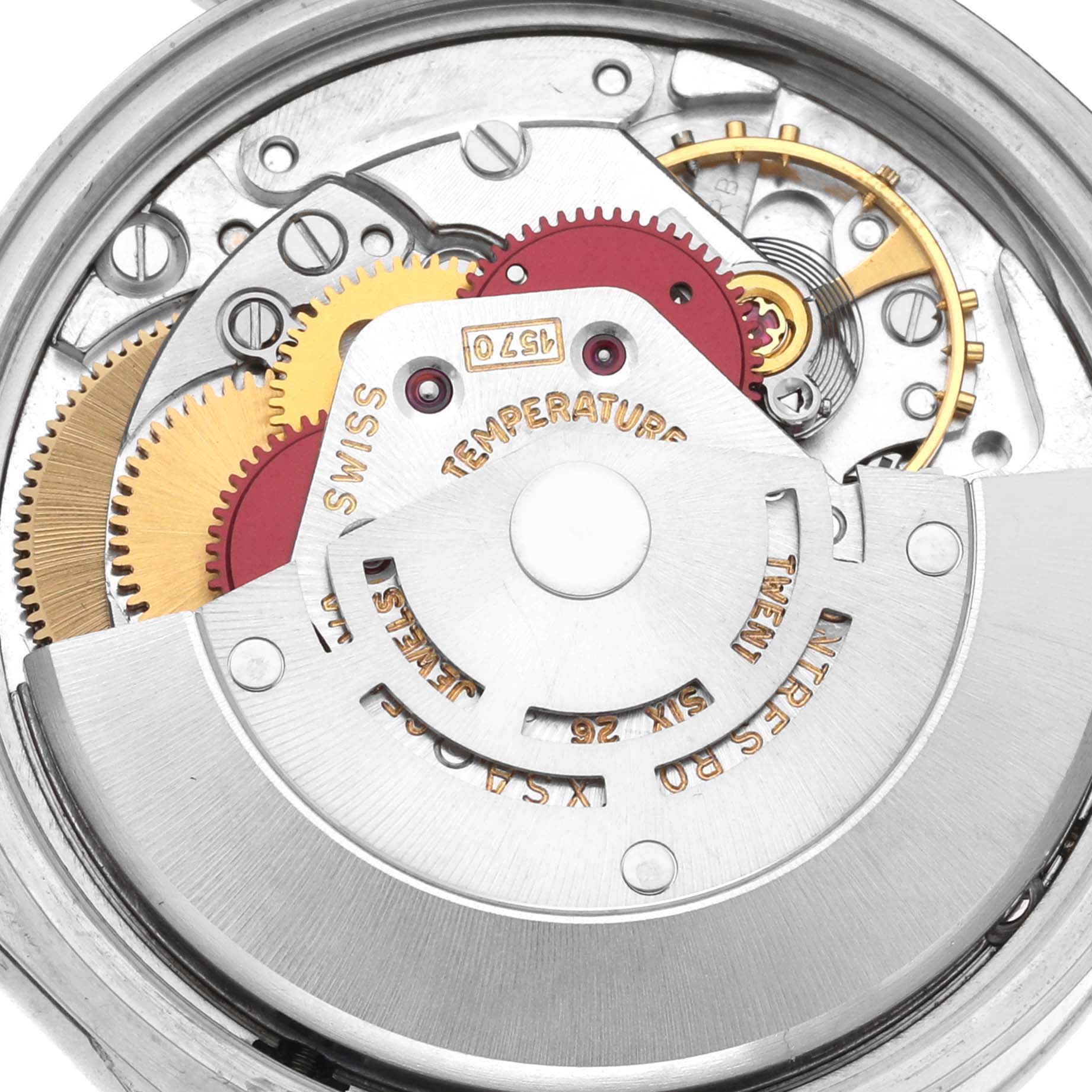 This image shows the internal mechanism of a Rolex Date 1500 Men's Stainless Steel Silver Dial 1500 Men's Stainless Steel Silver Dial watch from a close-up angle, highlighting gears and movement components.
