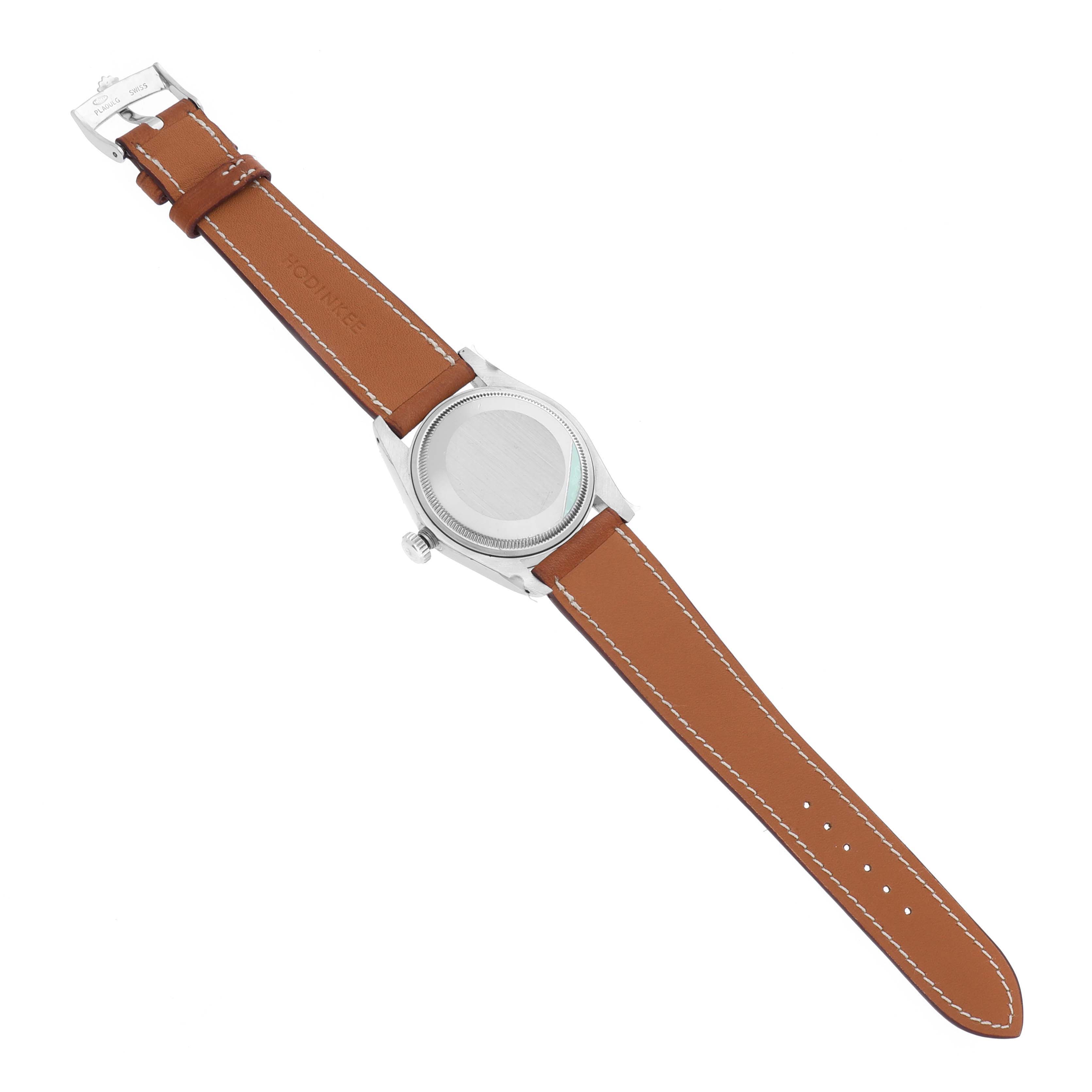 The image shows the back view of a Rolex Date 1500 Men's Stainless Steel Silver Dial 1500 Men's Stainless Steel Silver Dial watch with a brown leather strap and visible clasp.