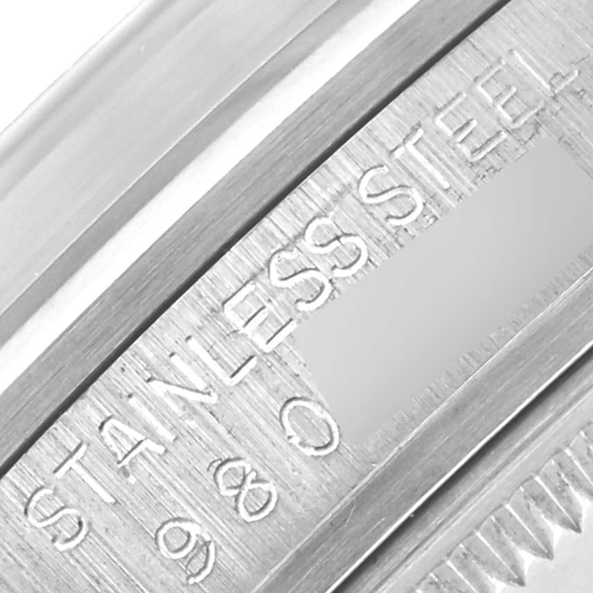 The image shows a close-up of the case back of a Rolex Date 15000 Men's Stainless Steel Silver Dial 15000 Men's Stainless Steel Silver Dial model, highlighting the "STAINLESS STEEL" engraving.