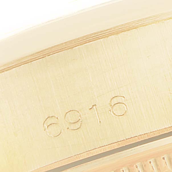 This close-up image shows the serial number "6916" engraved on the side of a Rolex President 6916 Women's Yellow Gold Champagne Dial 6916 Women's Yellow Gold Champagne Dial model watch.