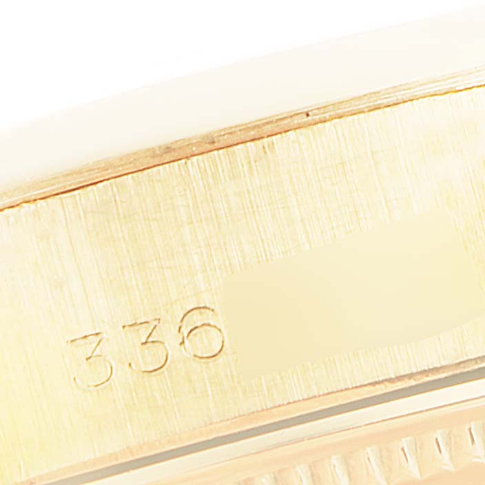 The image shows a close-up of the engraved side of the bezel from a Rolex President 6916 Women's Yellow Gold Champagne Dial 6916 Women's Yellow Gold Champagne Dial model watch.