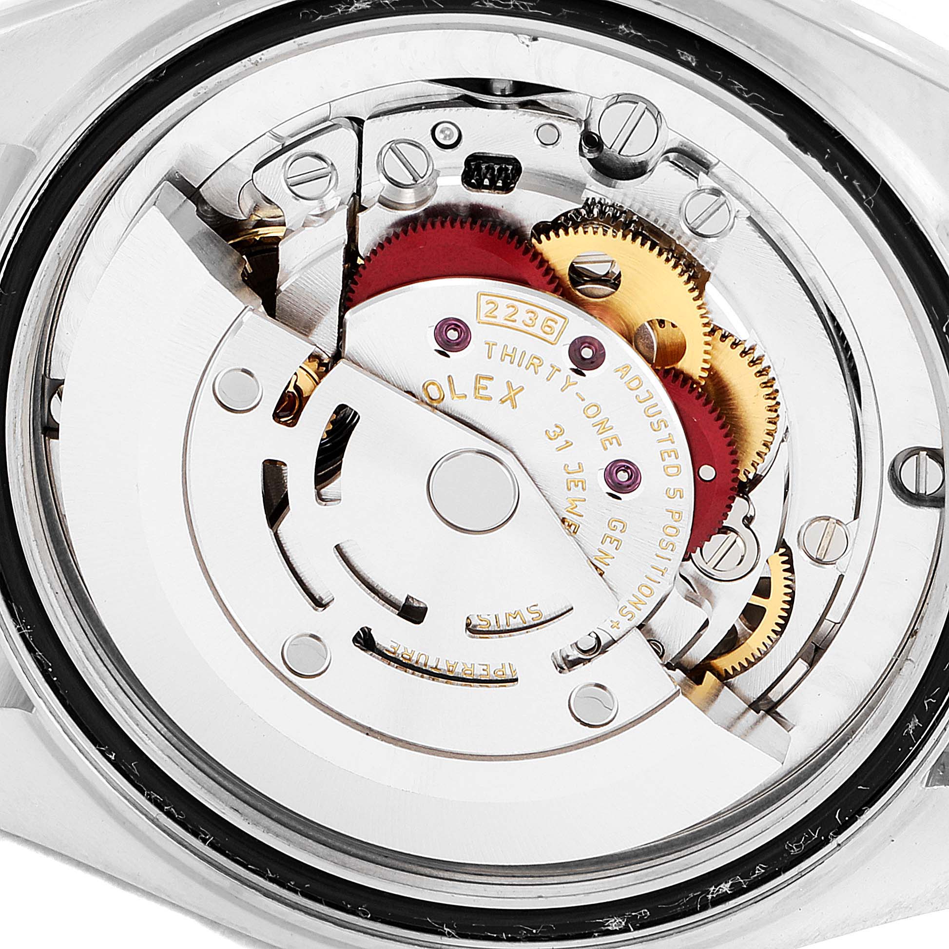 This image shows the internal mechanical movement of a Rolex Mid-Size 278381 Women's Steel and Gold (two tone) Pink Dial 278381 Women's Steel and Gold (two tone) Pink Dial model watch, highlighting the gears and intricate components.