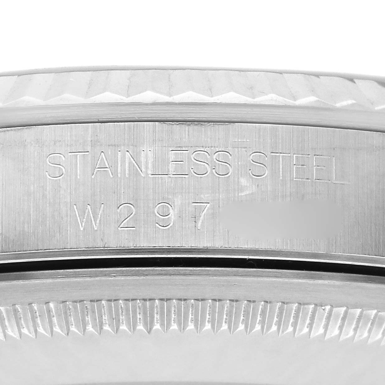 The image shows a side view of the bezel and serial number engraved on the Rolex Datejust 16234 Men's Stainless Steel Blue Dial 16234 Men's Stainless Steel Blue Dial's stainless steel case.