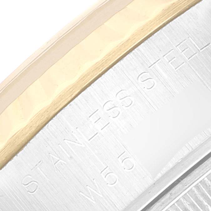 This image shows a close-up view of the bezel and part of the stainless steel case engraving of a Rolex Datejust 69173 Women's Steel and Gold (two tone) Blue Dial 69173 Women's Steel and Gold (two tone) Blue Dial watch.