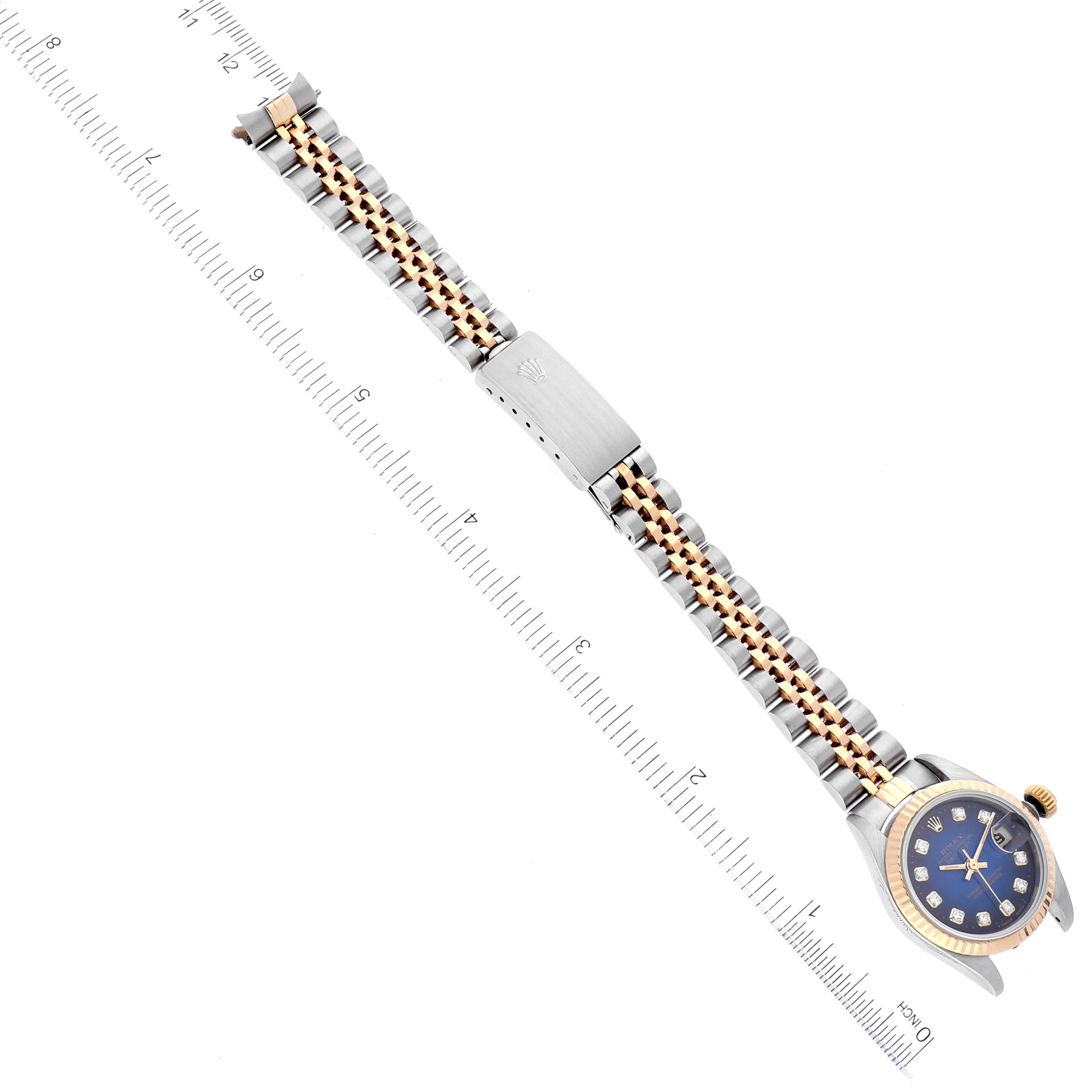 The image shows a Rolex Datejust 69173 Women's Steel and Gold (two tone) Blue Dial 69173 Women's Steel and Gold (two tone) Blue Dial watch from an overhead angle, featuring the watch face, bracelet, and clasp.