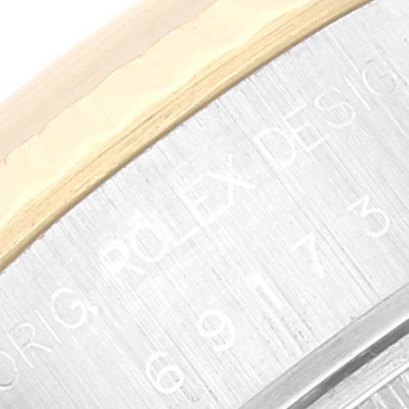This close-up image shows the side engraving on the case of a Rolex Datejust 69173 Women's Steel and Gold (two tone) Blue Dial 69173 Women's Steel and Gold (two tone) Blue Dial watch.