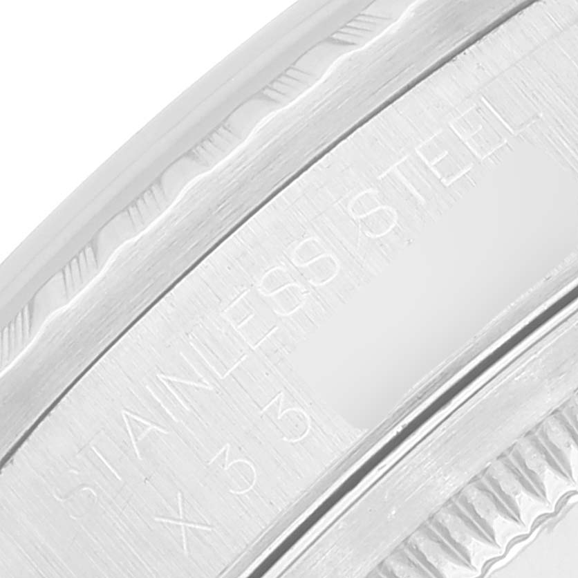 This close-up image shows the side engraving on the stainless steel case of a Rolex Datejust 16220 Men's Stainless Steel Silver Dial 16220 Men's Stainless Steel Silver Dial watch.