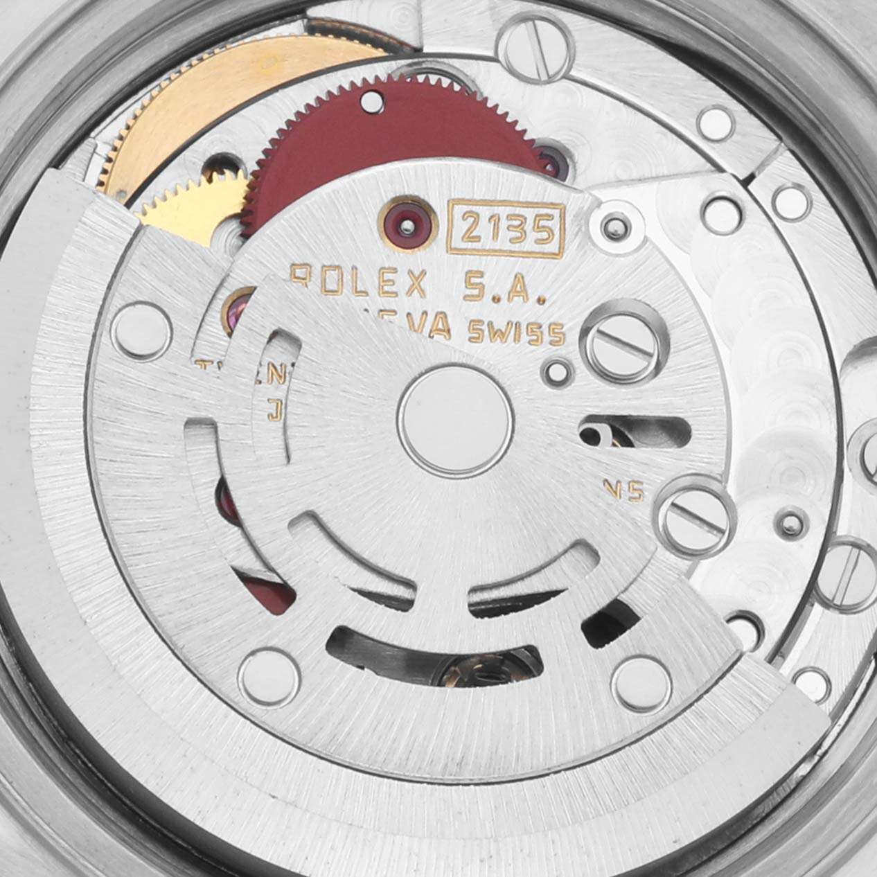 The image shows a close-up of the internal movement of a Rolex Datejust 69173 Women's Steel and Gold (two tone) Black Dial 69173 Women's Steel and Gold (two tone) Black Dial watch, highlighting gears and mechanisms.