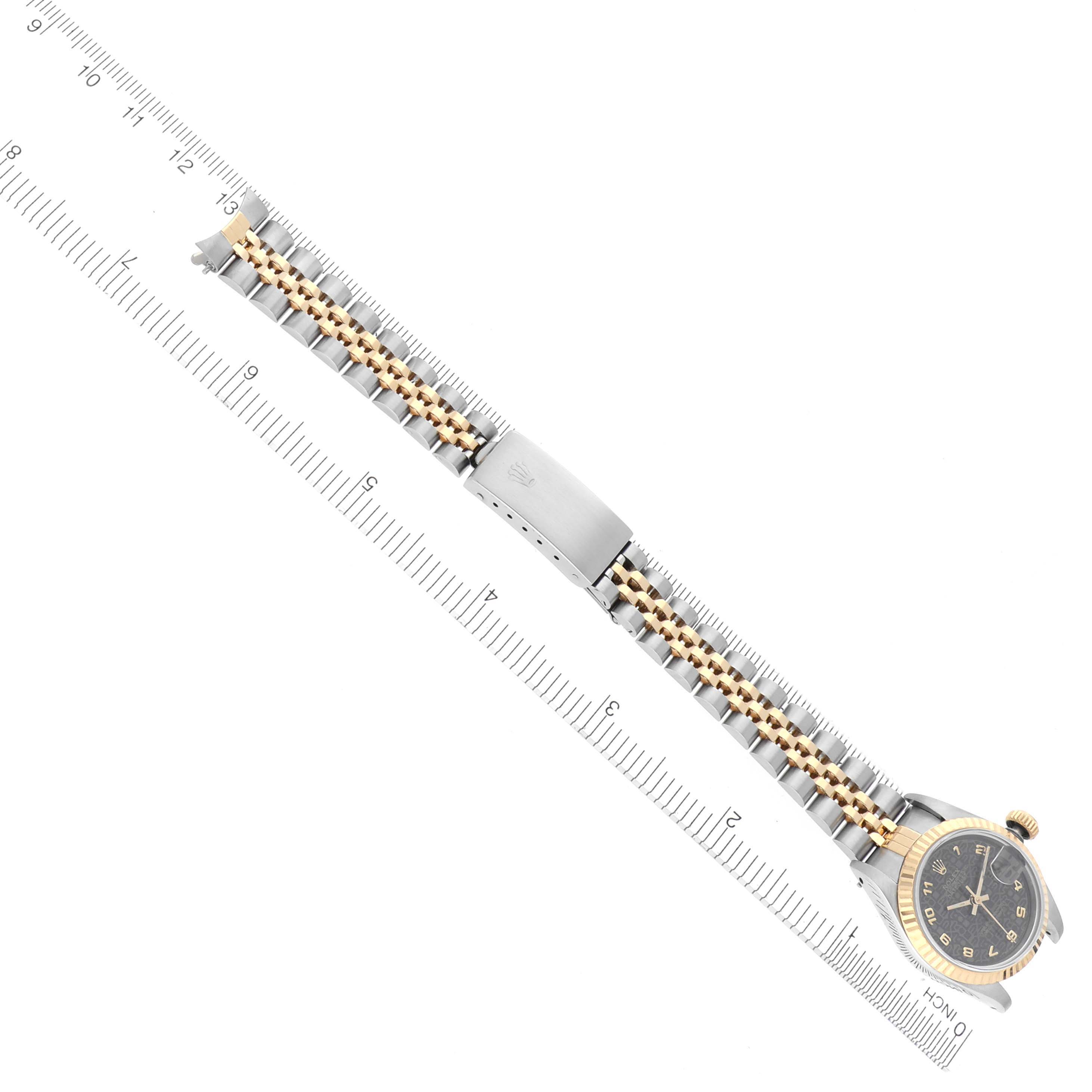 The Rolex Datejust 69173 Women's Steel and Gold (two tone) Black Dial 69173 Women's Steel and Gold (two tone) Black Dial watch is shown from above, highlighting its dial, bezel, and two-tone bracelet.