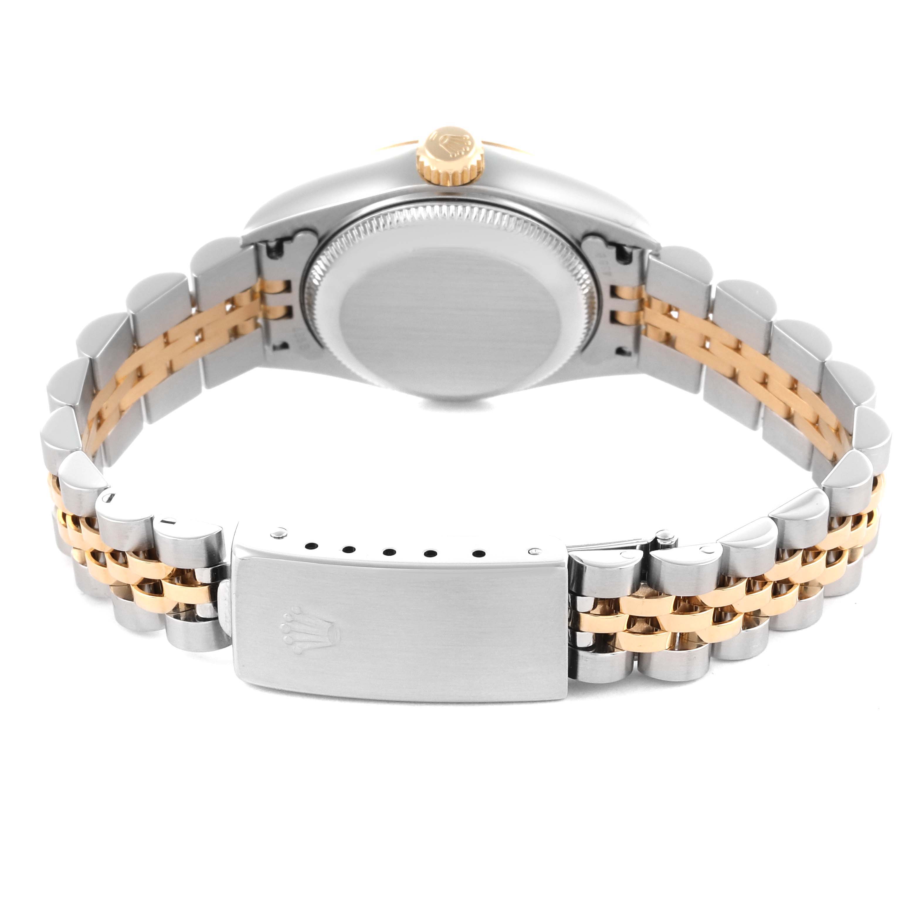 The Rolex Datejust 79173 Women's Steel and Gold (two tone) Champagne Dial 79173 Women's Steel and Gold (two tone) Champagne Dial watch is shown from the back, displaying its clasp and bracelet in a two-tone metal design.