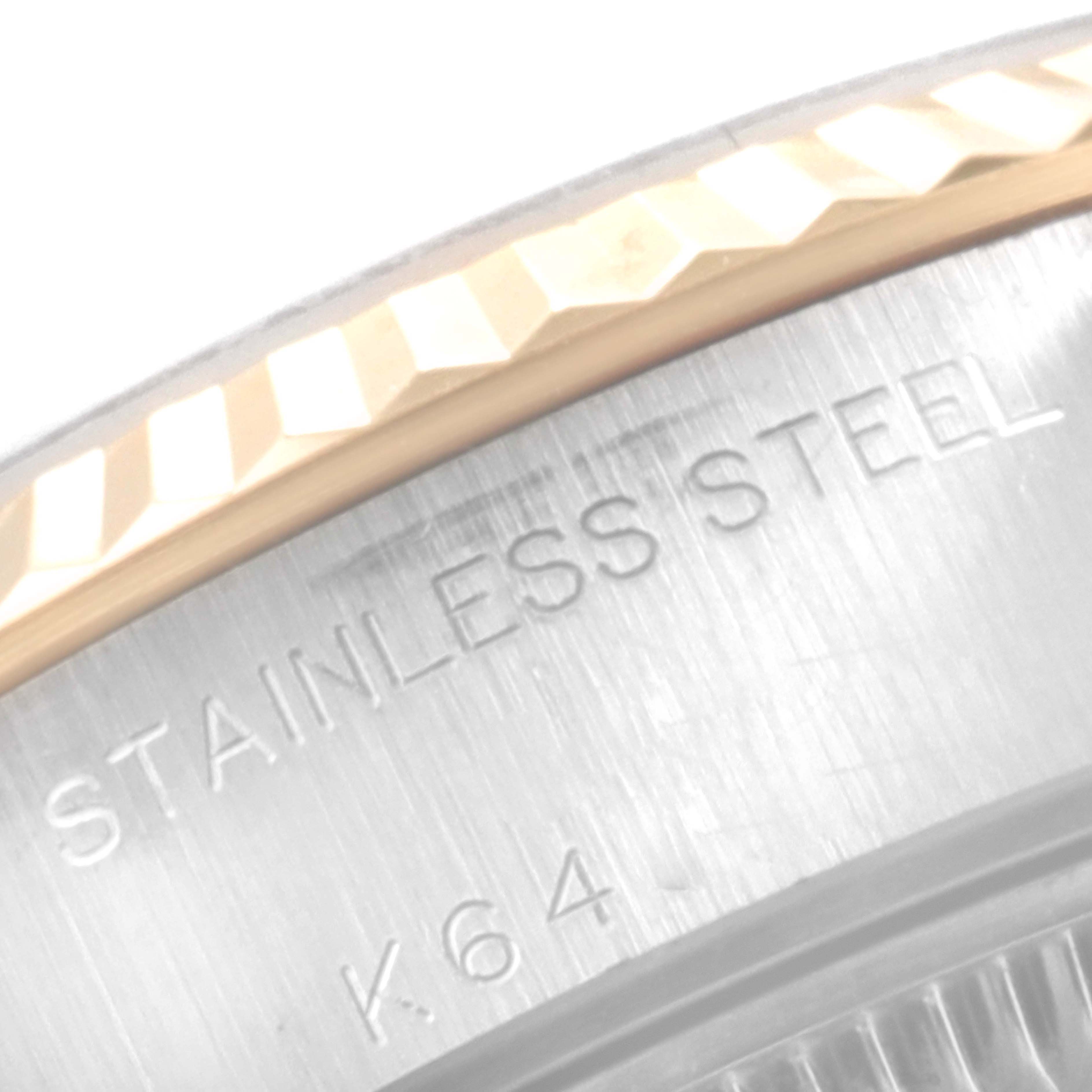 The image shows a close-up of the fluted bezel and part of the stainless steel case of the Rolex Datejust 79173 Women's Steel and Gold (two tone) Champagne Dial 79173 Women's Steel and Gold (two tone) Champagne Dial watch.