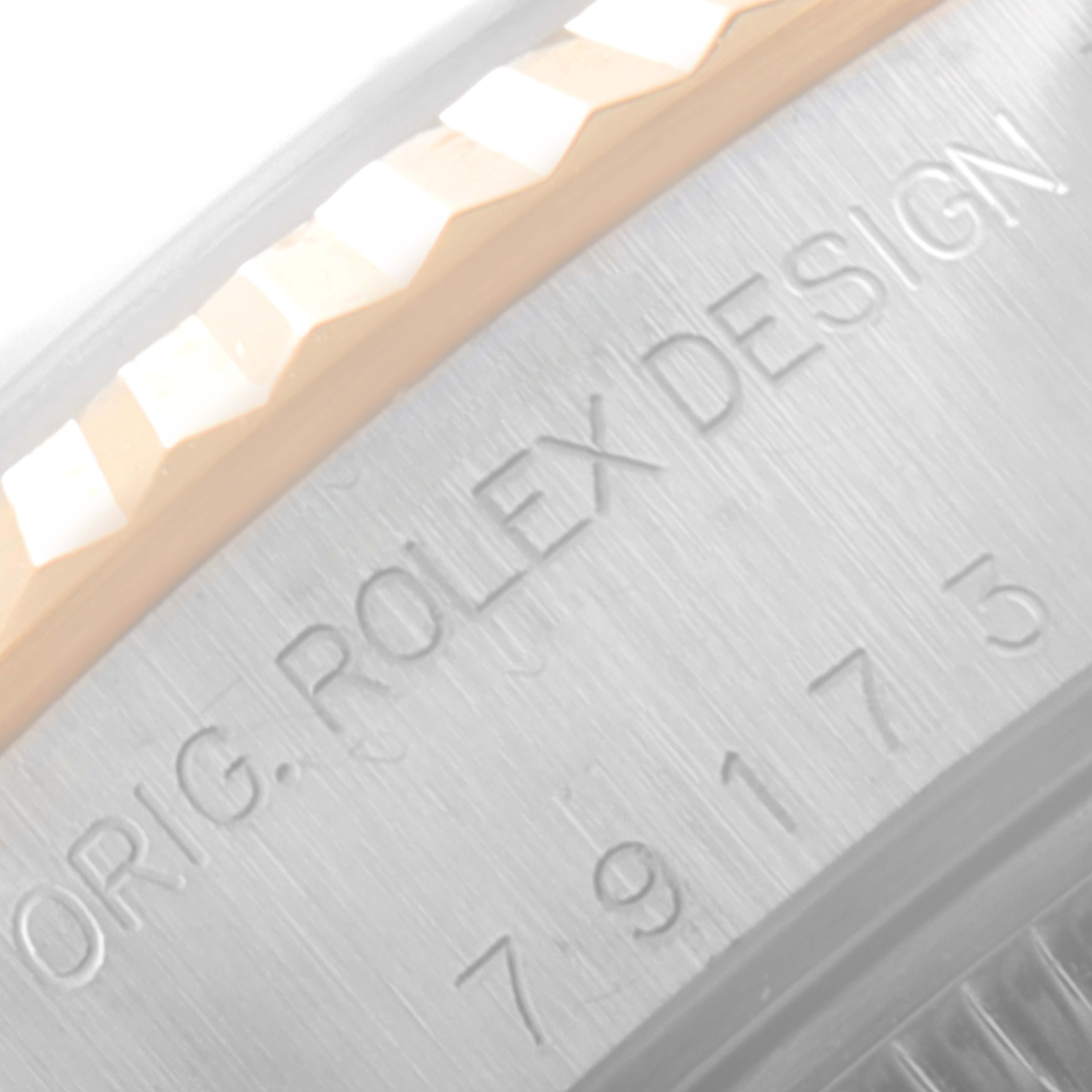 This close-up image shows the engraved details on the case edge of a Rolex Datejust 79173 Women's Steel and Gold (two tone) Champagne Dial 79173 Women's Steel and Gold (two tone) Champagne Dial watch.