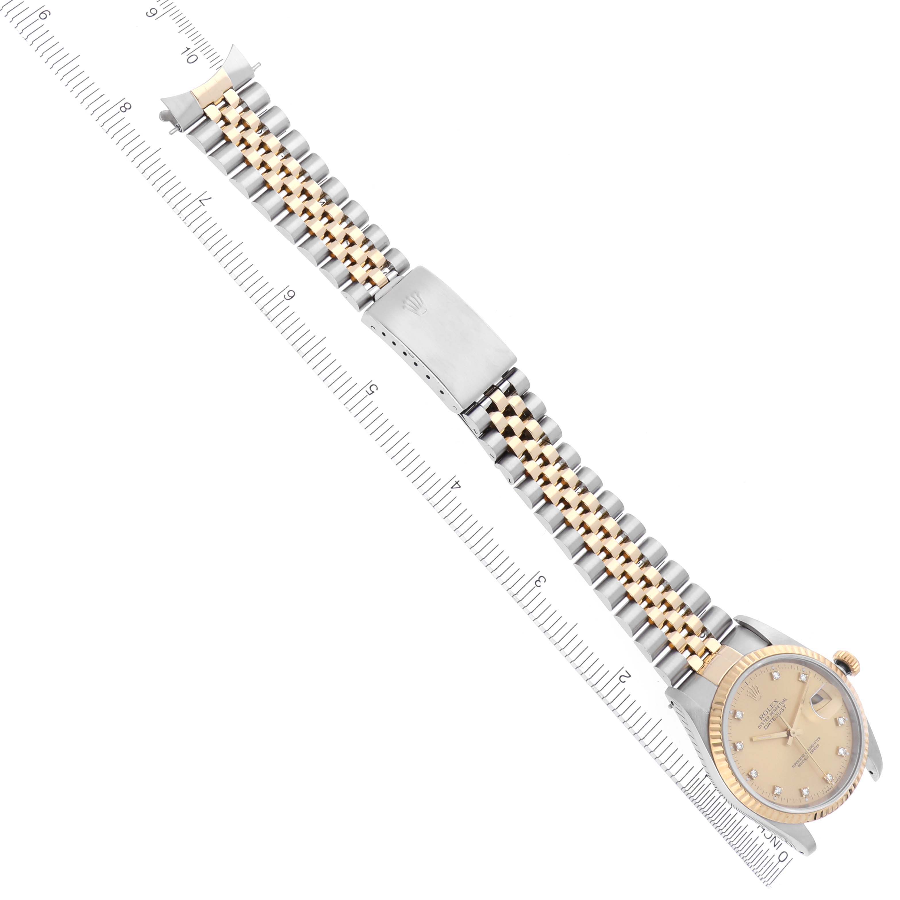 The Rolex Datejust 16233 Men's Steel and Gold (two tone) Champagne Dial 16233 Men's Steel and Gold (two tone) Champagne Dial is shown from an overhead angle, displaying the full watch with a jubilee bracelet and clasp.