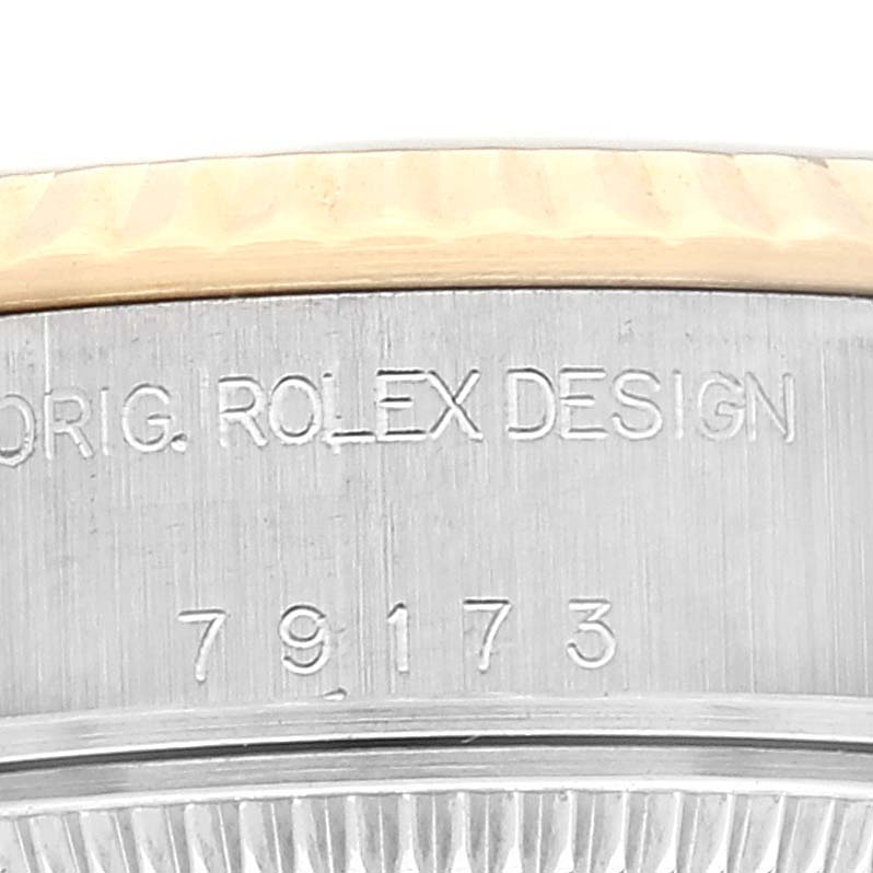 The image captures a close-up of the case side of a Rolex Datejust 79173 Women's Steel and Gold (two tone) Grey Dial 79173 Women's Steel and Gold (two tone) Grey Dial watch, displaying its model number "79173".