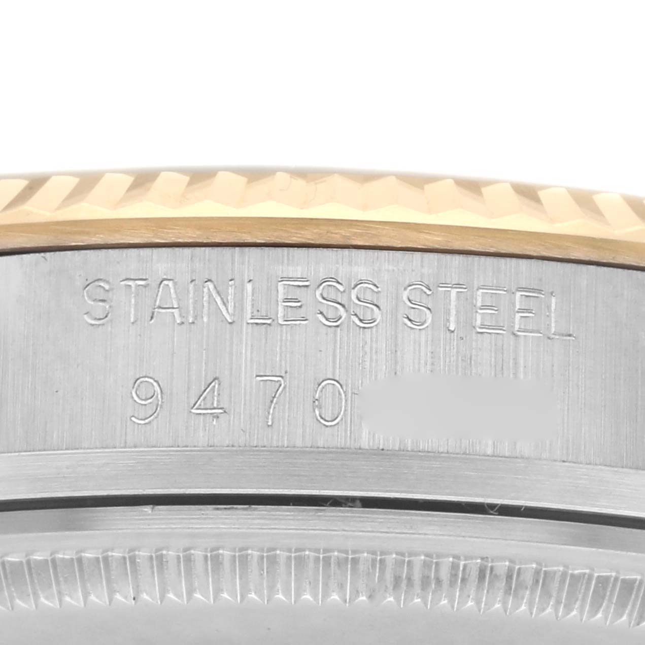 The image shows a close-up of the serial number engraving on the stainless steel case of a Rolex Datejust 16013 Men
s Steel and Gold (two tone) Champagne Dial 16013 Men
s Steel and Gold (two tone) Champagne Dial watch.
