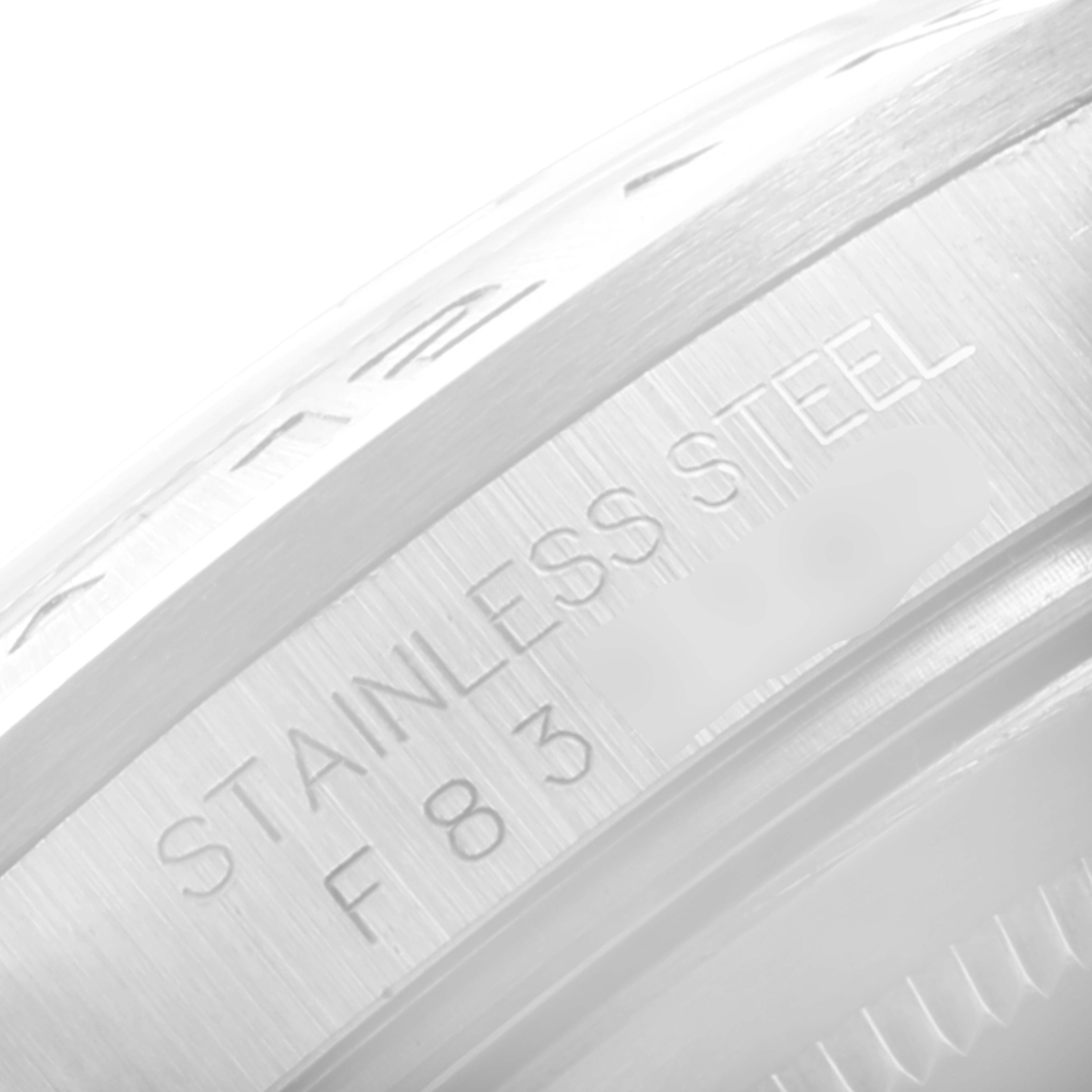 The image shows the side of the stainless steel casing of a Rolex Explorer 16570 Men's Stainless Steel White Dial 16570 Men's Stainless Steel White Dial watch.