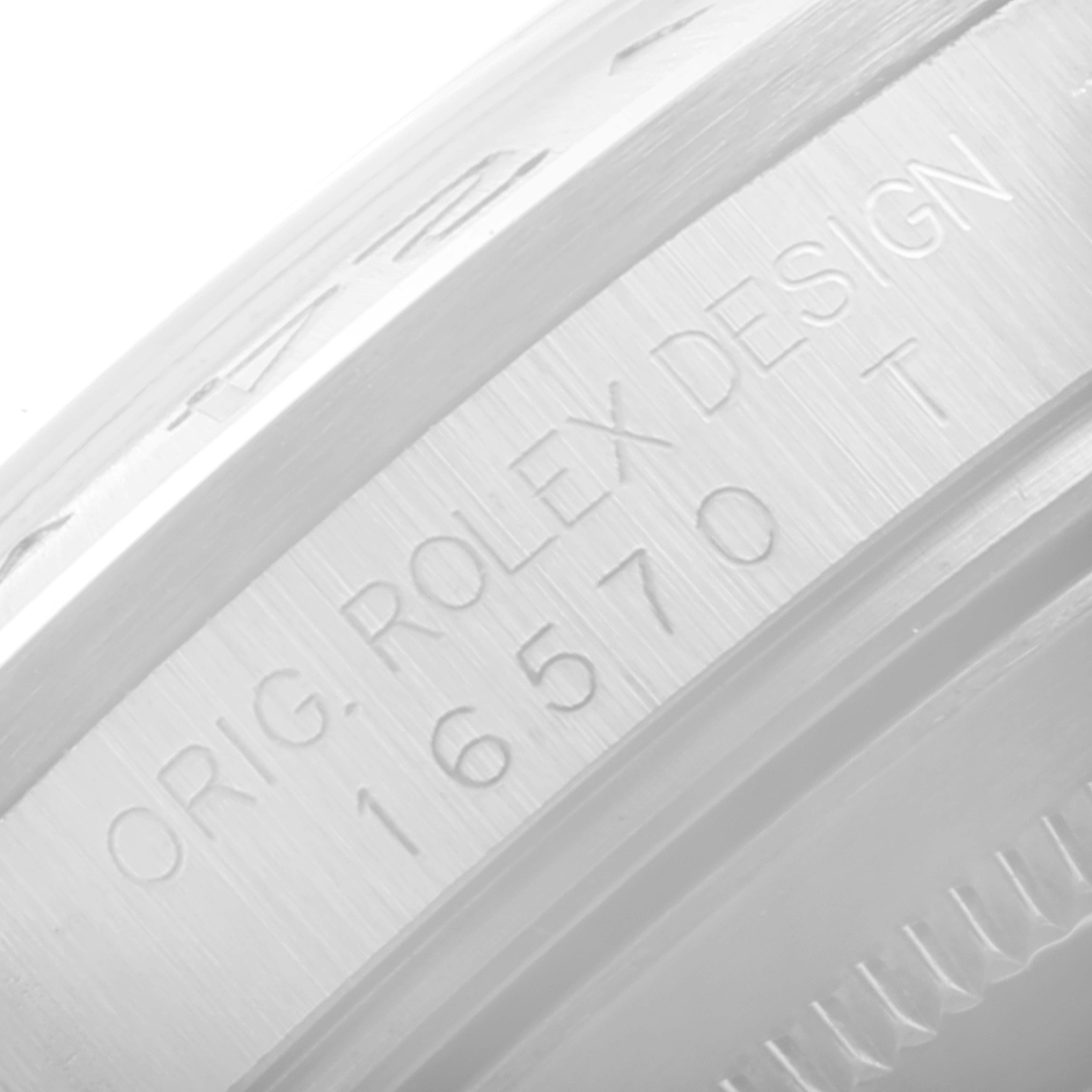 This close-up image shows the engraved model number and "ORIG. ROLEX DESIGN" on the side of the bezel of a Rolex Explorer 16570 Men's Stainless Steel White Dial 16570 Men's Stainless Steel White Dial watch.