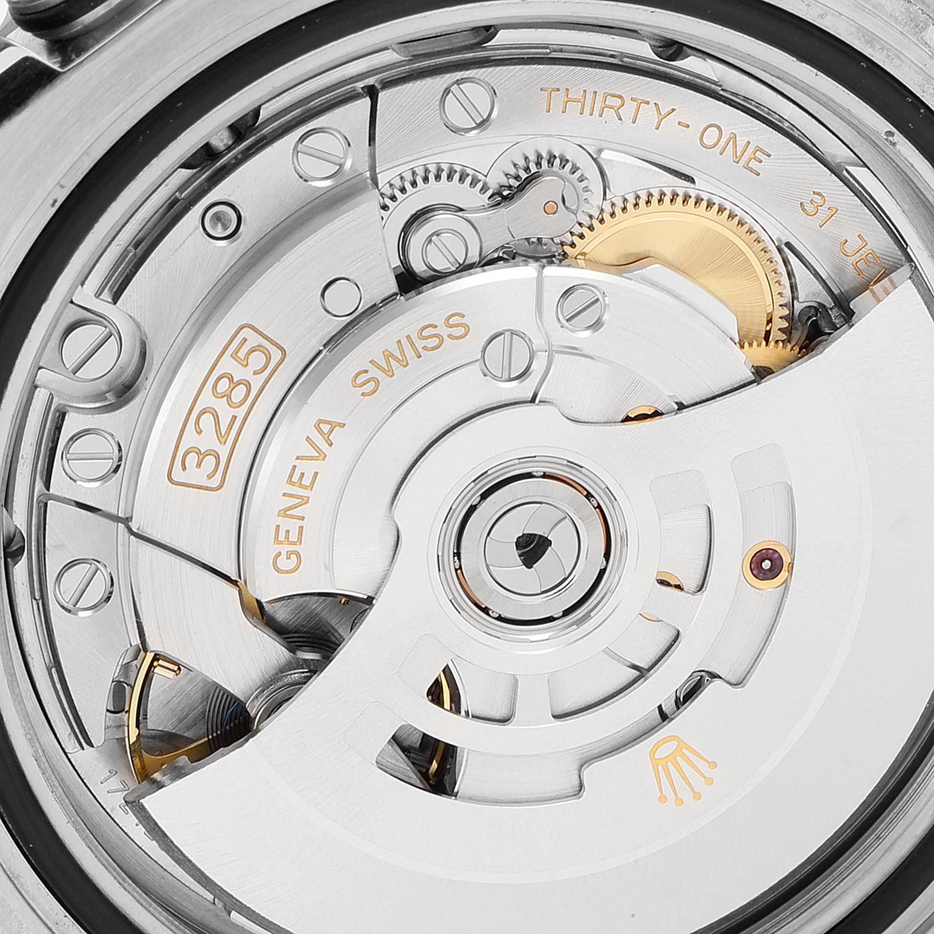 This image shows a close-up of the movement mechanism of a Rolex GMT-Master 126710 Men's Stainless Steel Black Dial 126710 Men's Stainless Steel Black Dial watch, featuring the 3285 Geneva Swiss calibre.