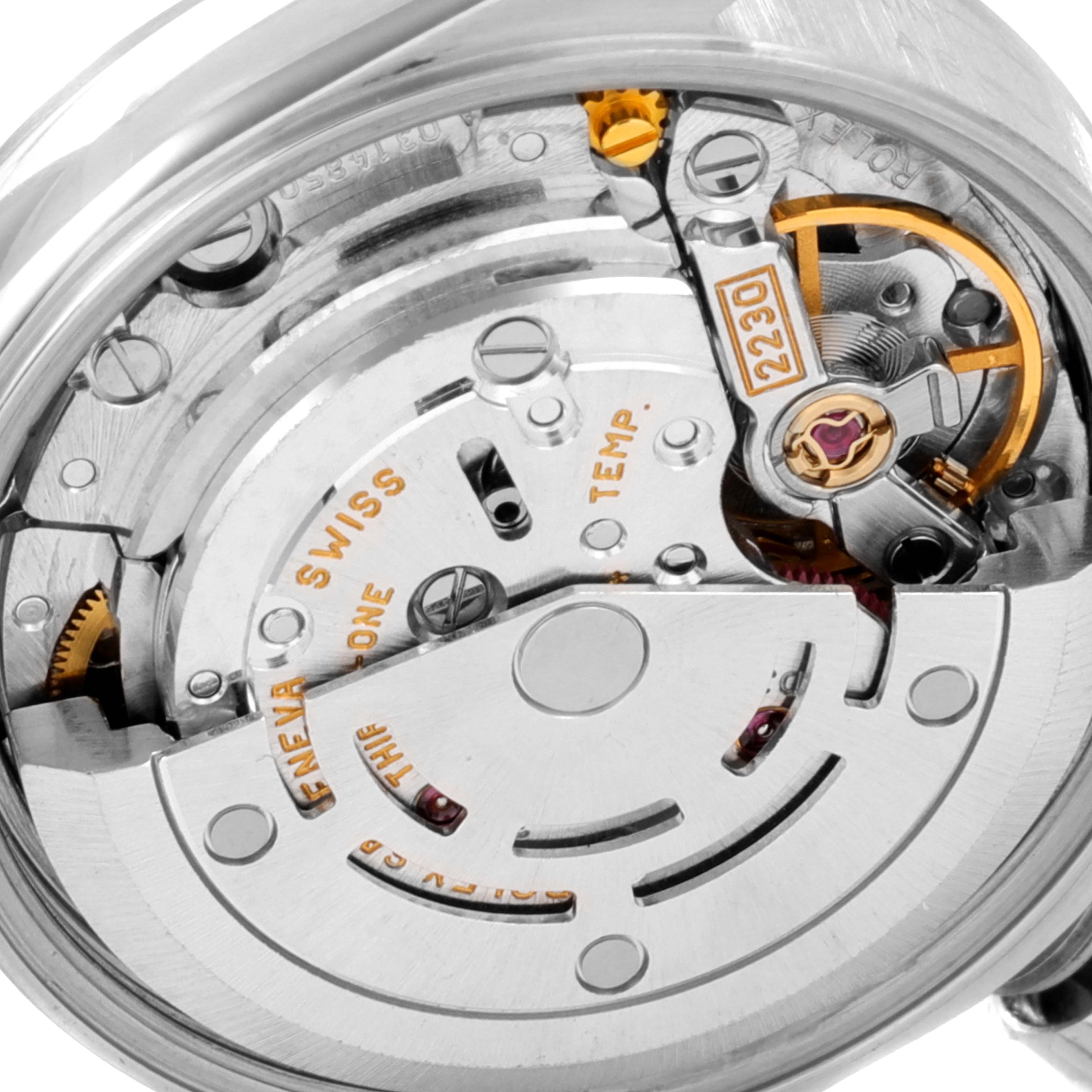 This image shows the internal mechanism and movement of a Rolex Oyster Perpetual 76080 Women's Stainless Steel Pink Dial 76080 Women's Stainless Steel Pink Dial watch, focusing on the gears and components.