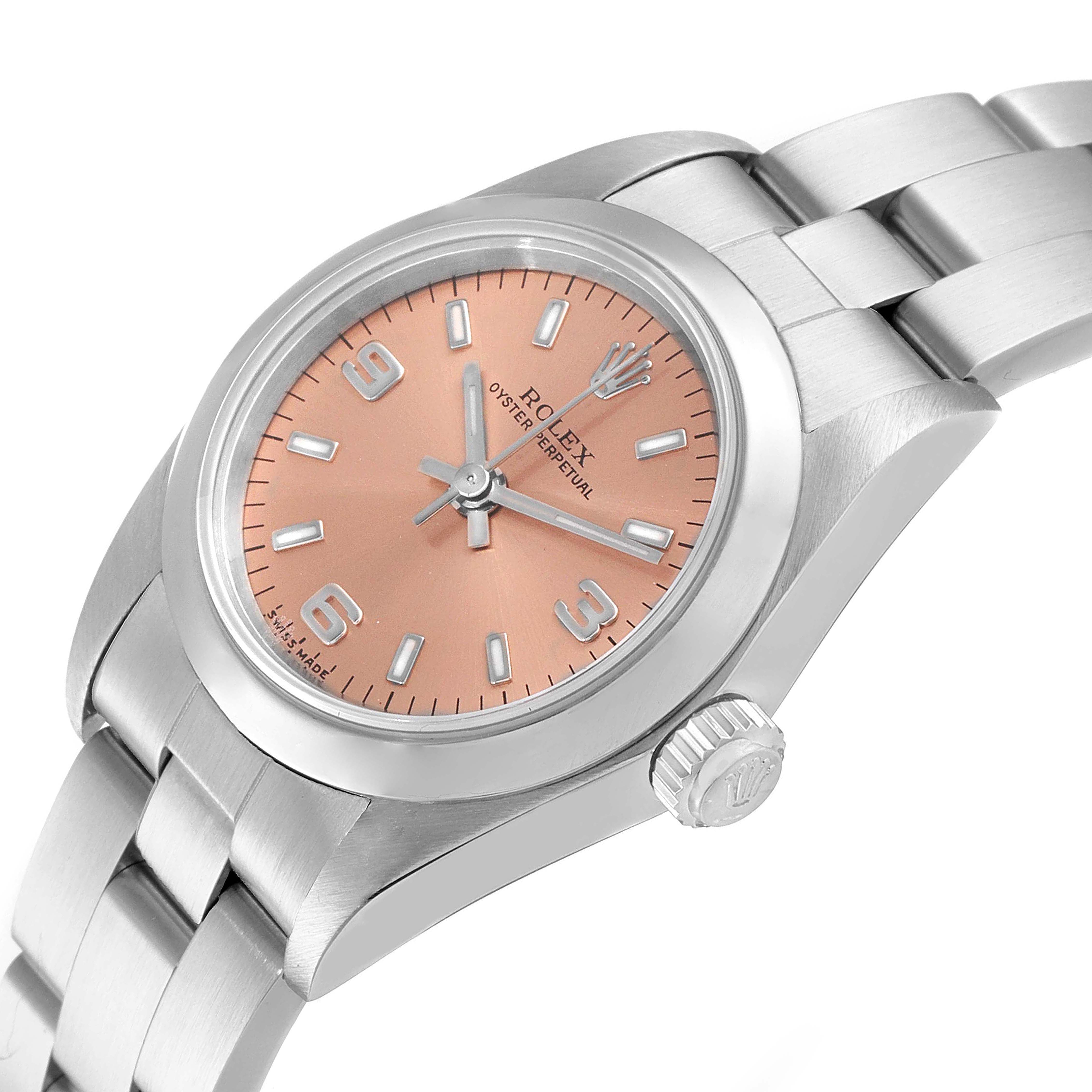 The image shows a Rolex Oyster Perpetual 76080 Women's Stainless Steel Pink Dial 76080 Women's Stainless Steel Pink Dial watch from an angled side view, highlighting the dial, crown, and part of the bracelet.