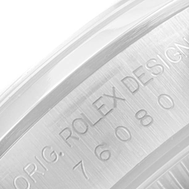 This image shows a close-up of the engraved serial number and design details on the caseback of the Rolex Oyster Perpetual 76080 Women's Stainless Steel Pink Dial 76080 Women's Stainless Steel Pink Dial watch.