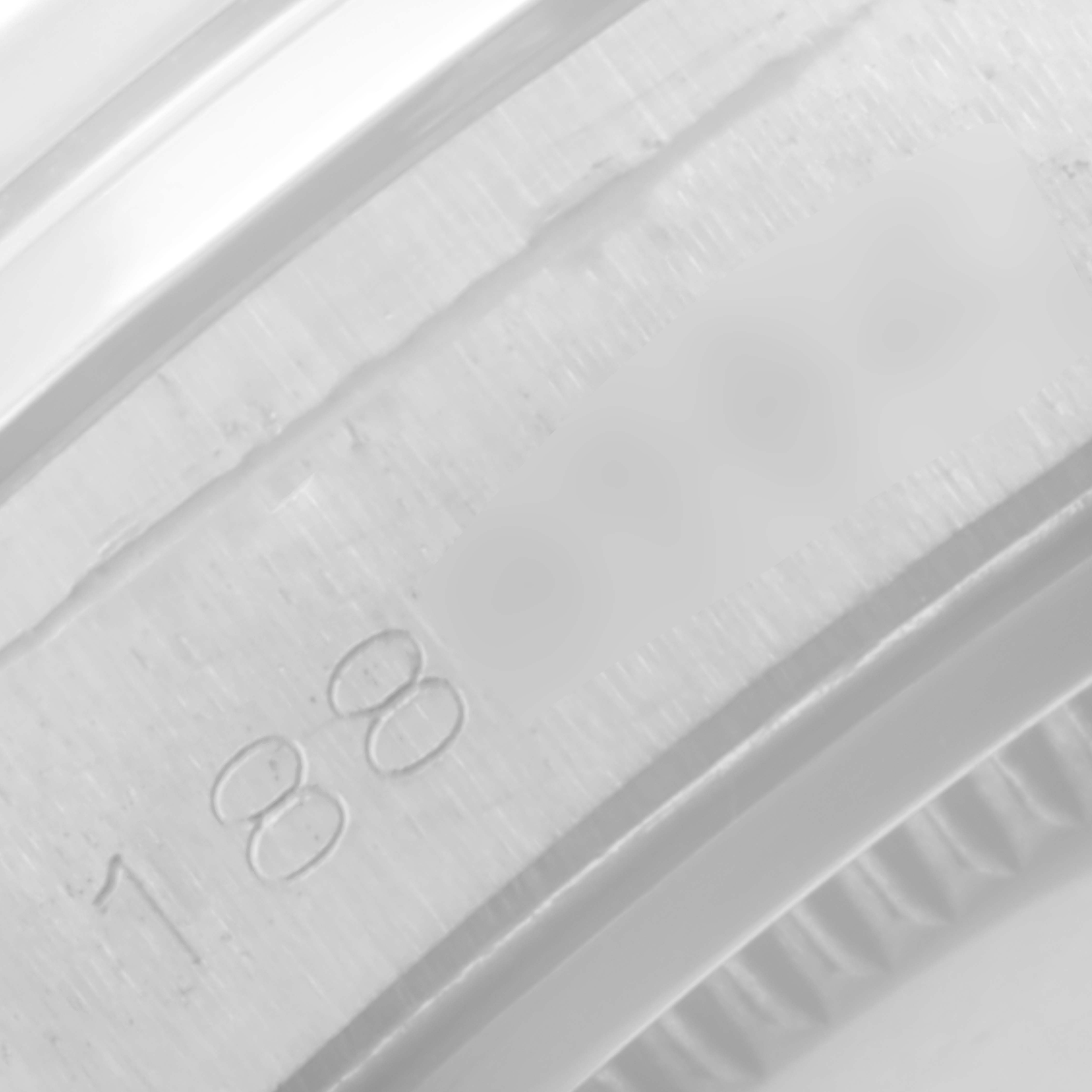 This close-up image shows a partial view of the case serial number engraving on a Vintage Collection model by Rolex.