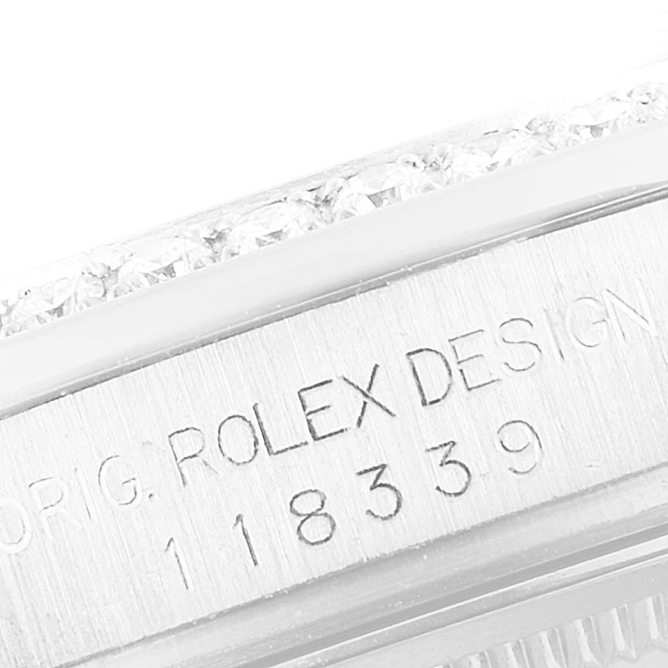The image shows the engraved side of the case of a Rolex President 118339 Men's White Gold Black Dial 118339 Men's White Gold Black Dial watch, including the model number and "ROLEX DESIGN".