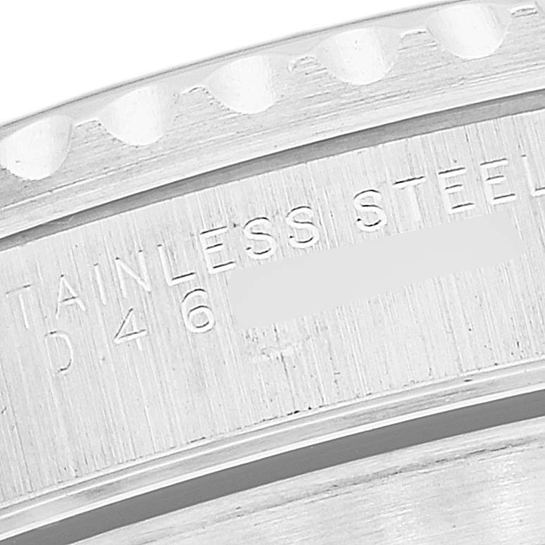 This close-up of a Rolex Submariner 14060M Men
s Stainless Steel Black Dial 14060M Men
s Stainless Steel Black Dial watch shows part of the inner case and engraved serial number.