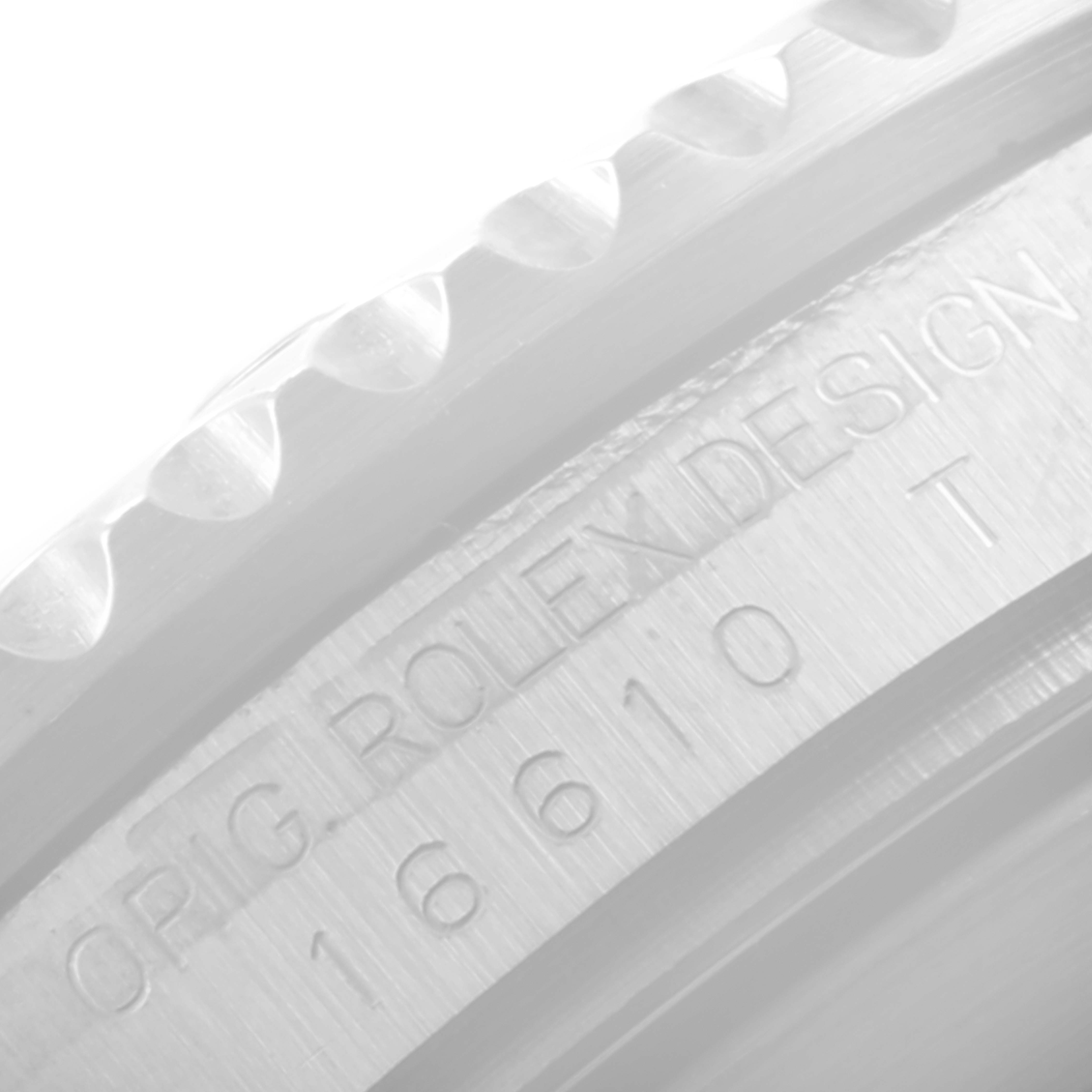 Close-up of the Rolex Submariner 16610 Men's Stainless Steel Black Dial 16610 Men's Stainless Steel Black Dial watch case showing its model number and Rolex design engraving.