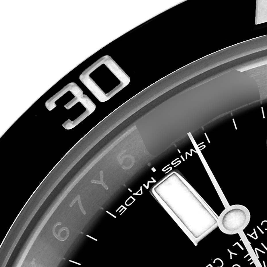 The image shows a close-up of the bezel and dial of a Rolex Submariner 116610LN Men's Stainless Steel Black Dial 116610LN Men's Stainless Steel Black Dial, focusing on the numeral and minute markers.