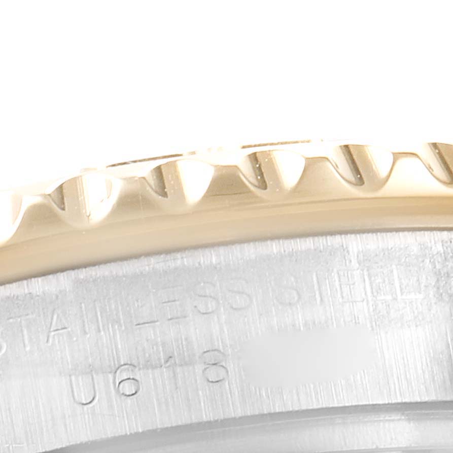 This image shows a close-up of the bezel and part of the case back of the Rolex Yacht-Master 69623 Women's Steel and Gold (two tone) Champagne Dial 69623 Women's Steel and Gold (two tone) Champagne Dial watch.
