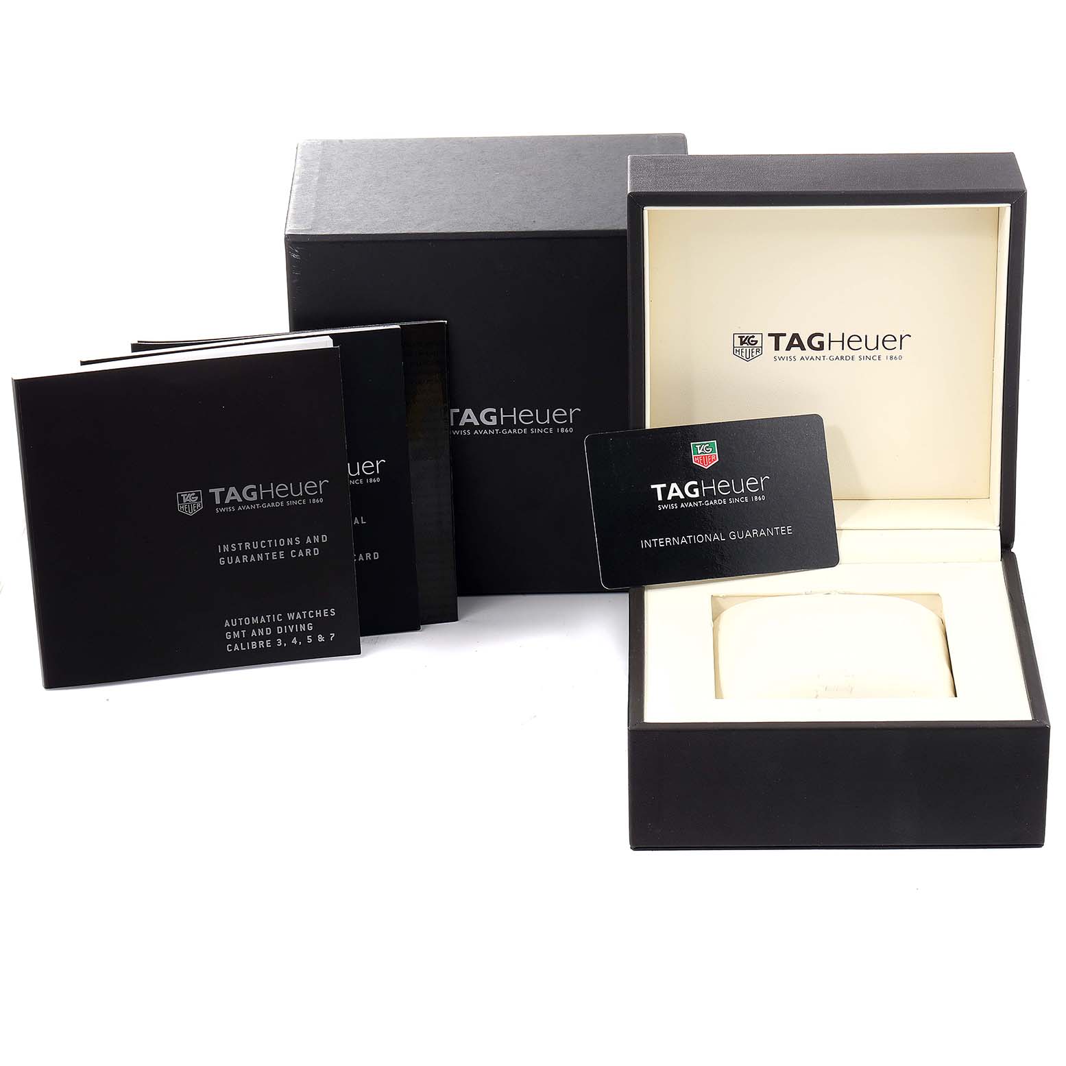 The image shows the Tag Heuer Aquaracer CAF101C.BA0821 Men's Stainless Steel Blue Dial CAF101C.BA0821 Men's Stainless Steel Blue Dial packaging, including the watch box, international guarantee card, and instruction booklets.