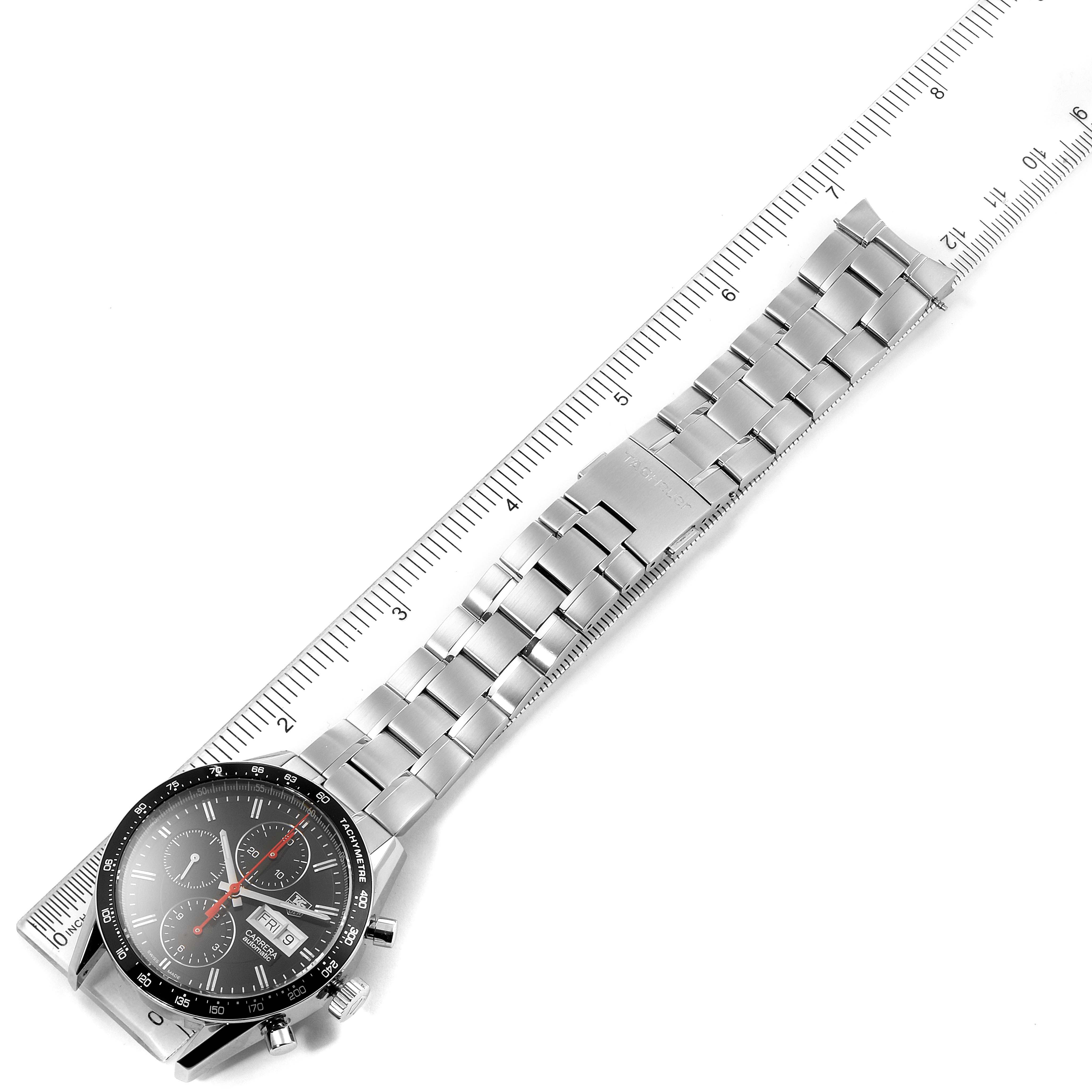 The image shows a Tag Heuer Carrera CV201AHBA0725  Men's Stainless Steel Black Dial CV201AHBA0725  Men's Stainless Steel Black Dial watch laid flat, with its face and stainless steel bracelet measured against a ruler.