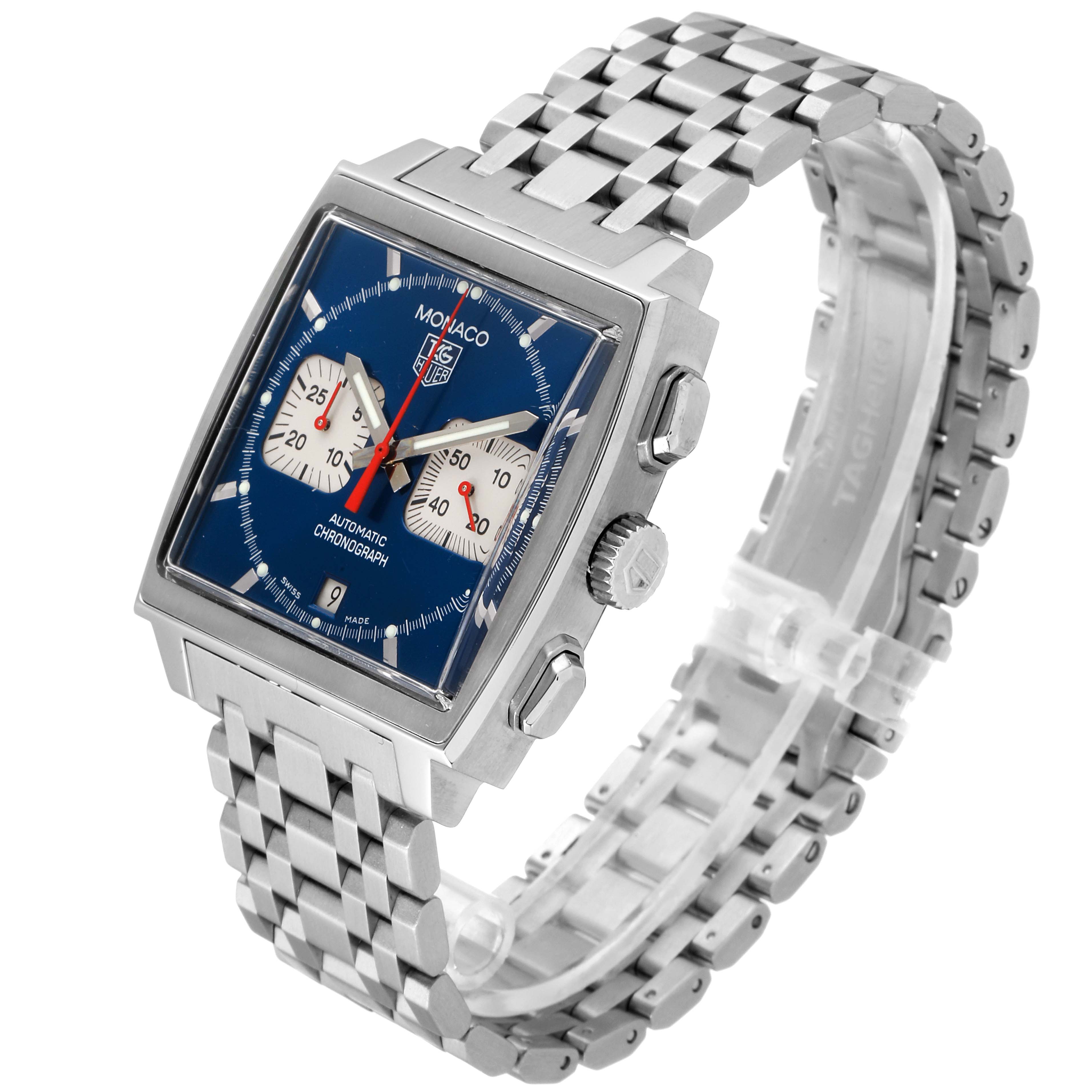 The image shows a Tag Heuer Monaco CW2113.BA0780 Men's Stainless Steel Blue Dial CW2113.BA0780 Men's Stainless Steel Blue Dial watch at a three-quarter angle, showcasing its square face, blue dial, and metal bracelet.