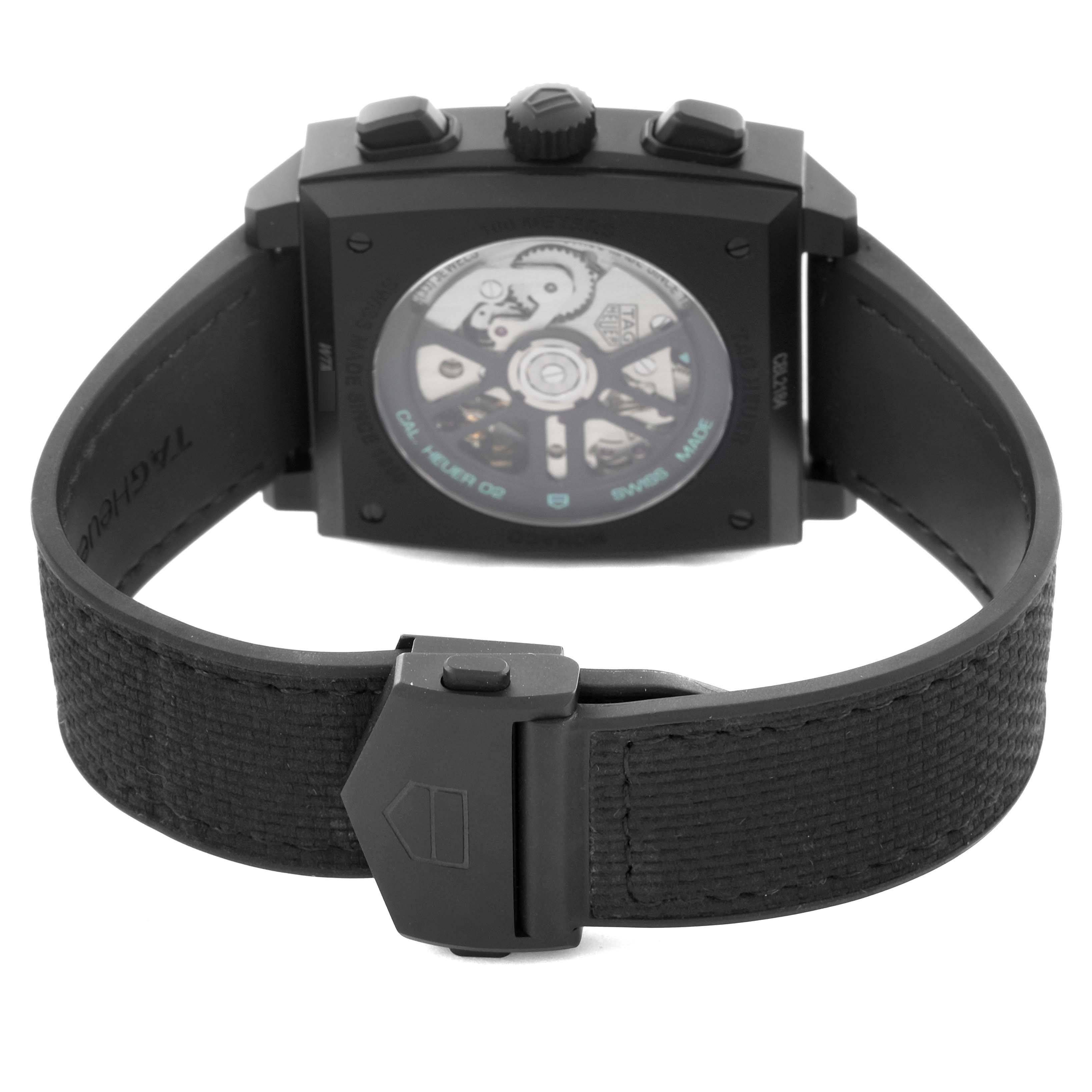 The image shows the Tag Heuer Monaco CBL2184.FT6236 Men's Titanium Transparent Dial CBL2184.FT6236 Men's Titanium Transparent Dial watch from the back, highlighting the movement and clasp.