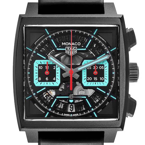 The image shows a front view of the Tag Heuer Monaco watch, highlighting its square dial and intricate chronograph features.