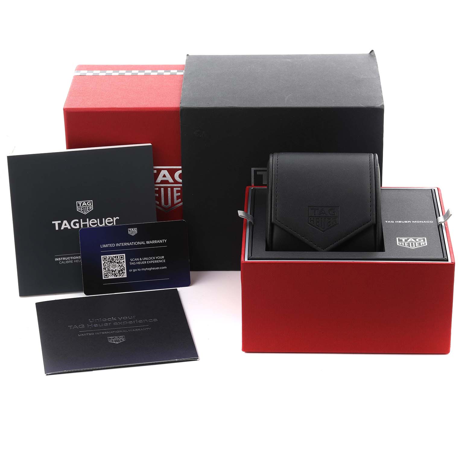 The image shows a Tag Heuer Monaco CBL2184.FT6236 Men's Titanium Transparent Dial CBL2184.FT6236 Men's Titanium Transparent Dial watch box, warranty card, manuals, and a travel pouch from a frontal angle.