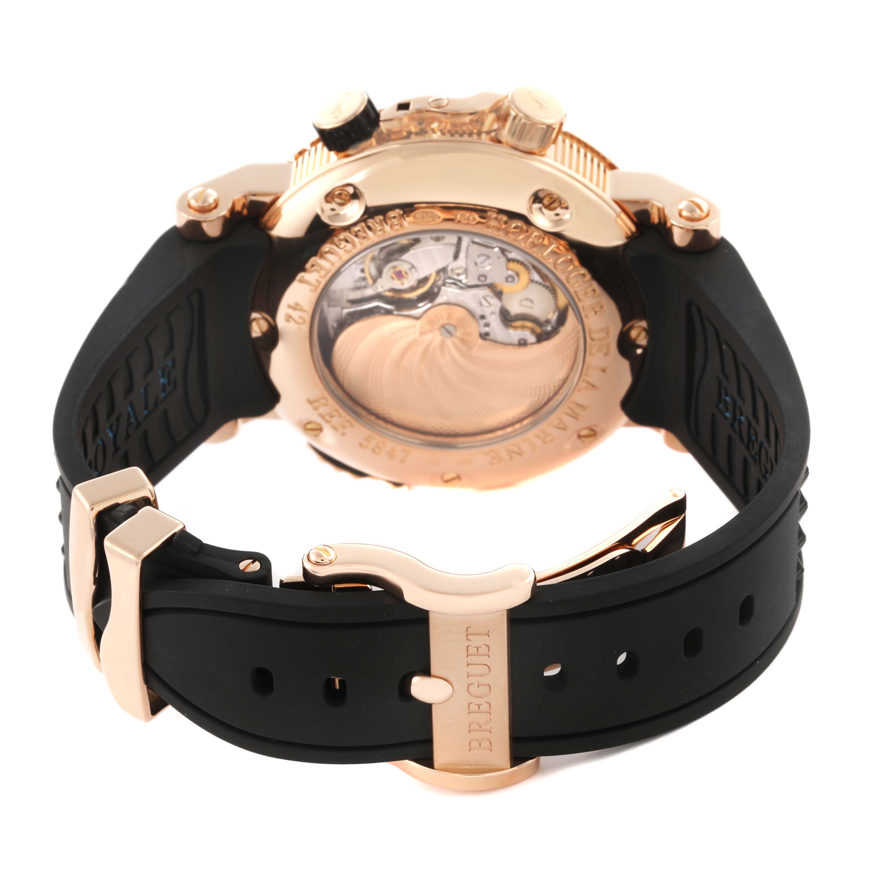 The image shows the back of the Breguet Marine 5847BR/Z2/5ZV Men's Rose Gold Black Dial 5847BR/Z2/5ZV Men's Rose Gold Black Dial watch, highlighting the case and movement through the transparent caseback.