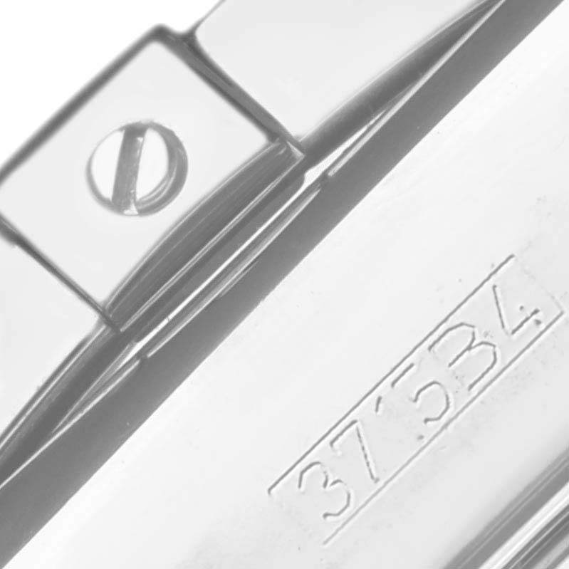 The image shows a close-up of the clasp or buckle of the Breitling Chronomat AB0420 Men's Stainless Steel Black Dial AB0420 Men's Stainless Steel Black Dial watch, focusing on its engraving and screw detail.