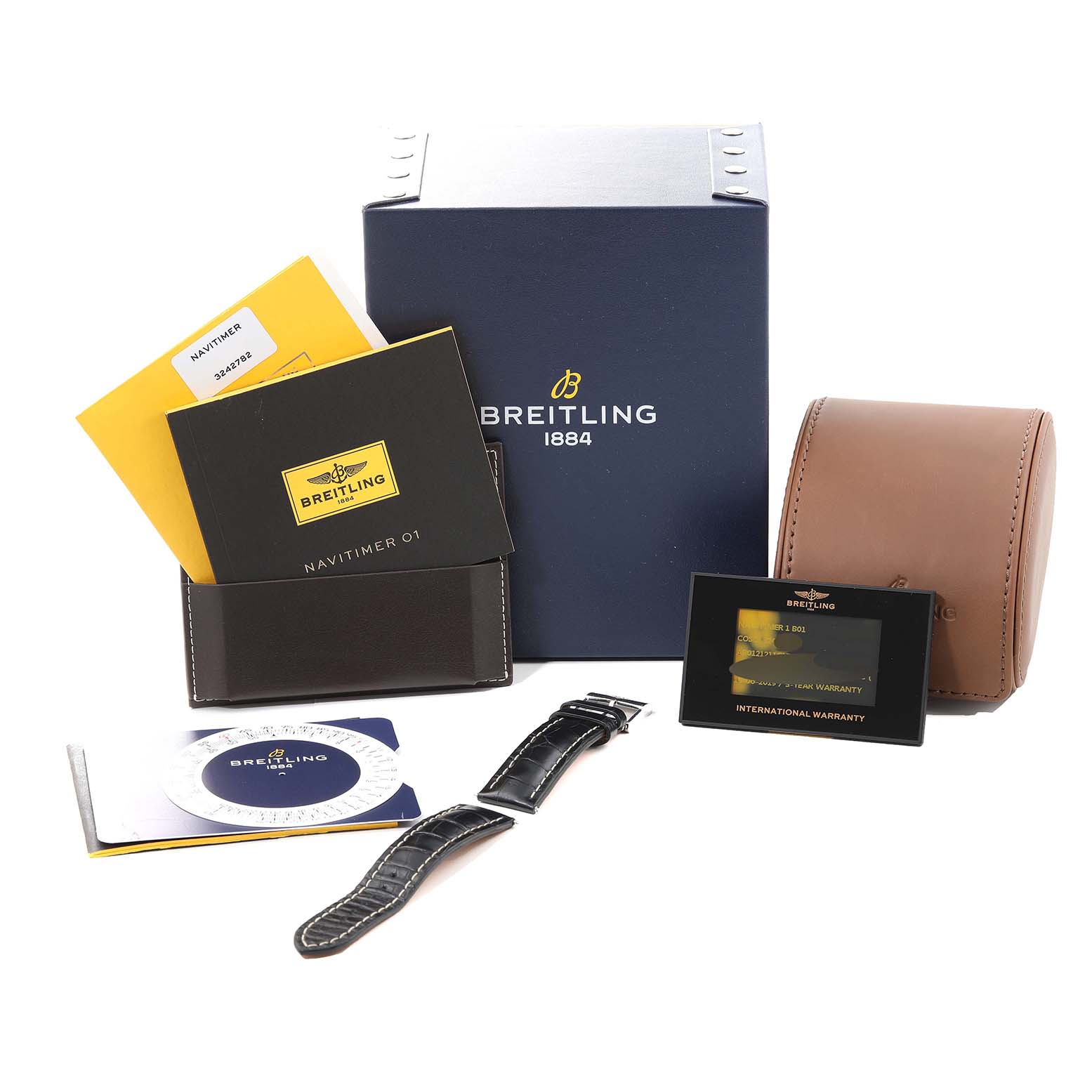 The image shows the accessories and packaging for a Breitling Navitimer AB0121 Men
s Stainless Steel Blue Dial AB0121 Men
s Stainless Steel Blue Dial watch, including manuals, warranty cards, and straps.